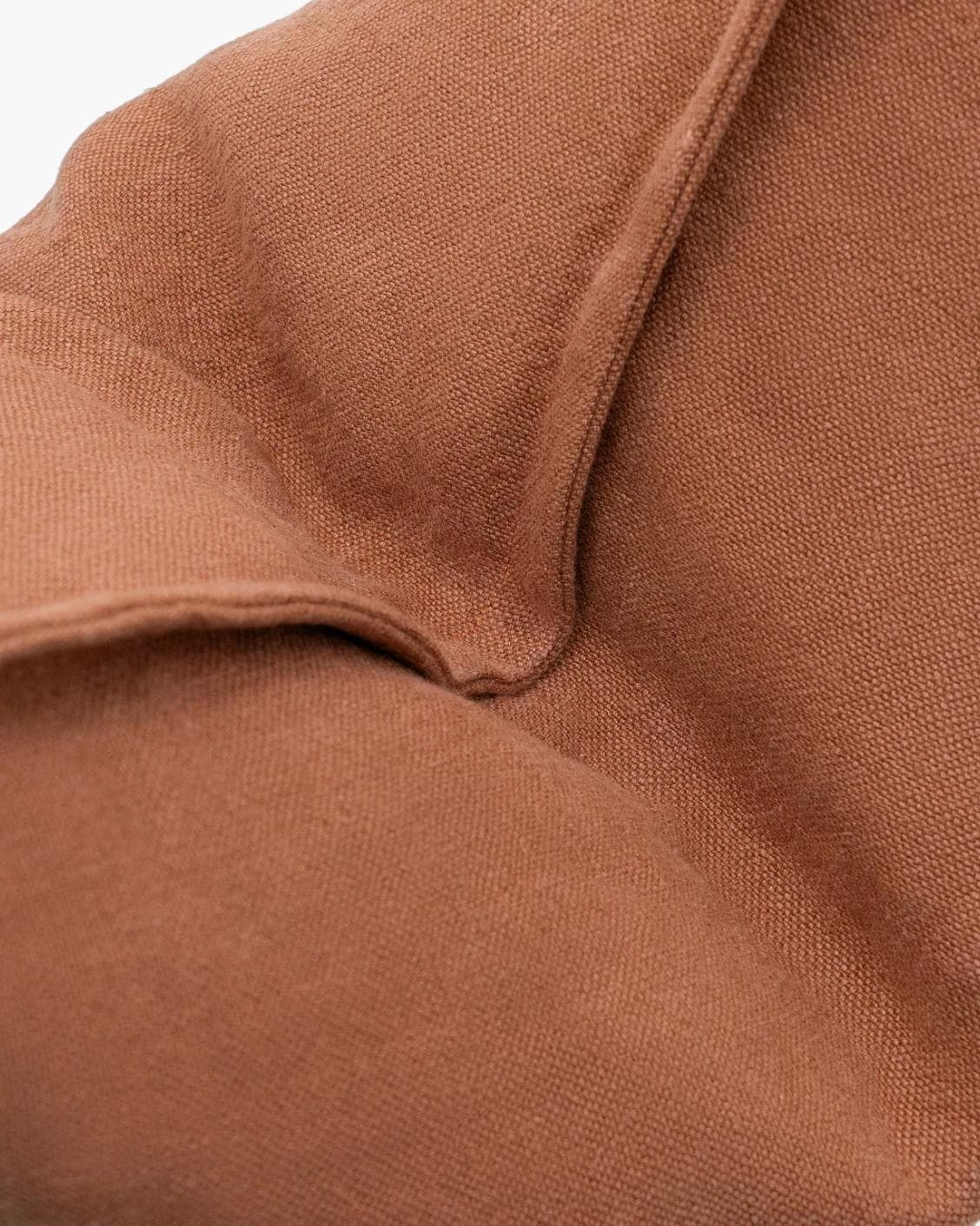 Mel Brick cushion in rust, shown in a product close-up as image 7