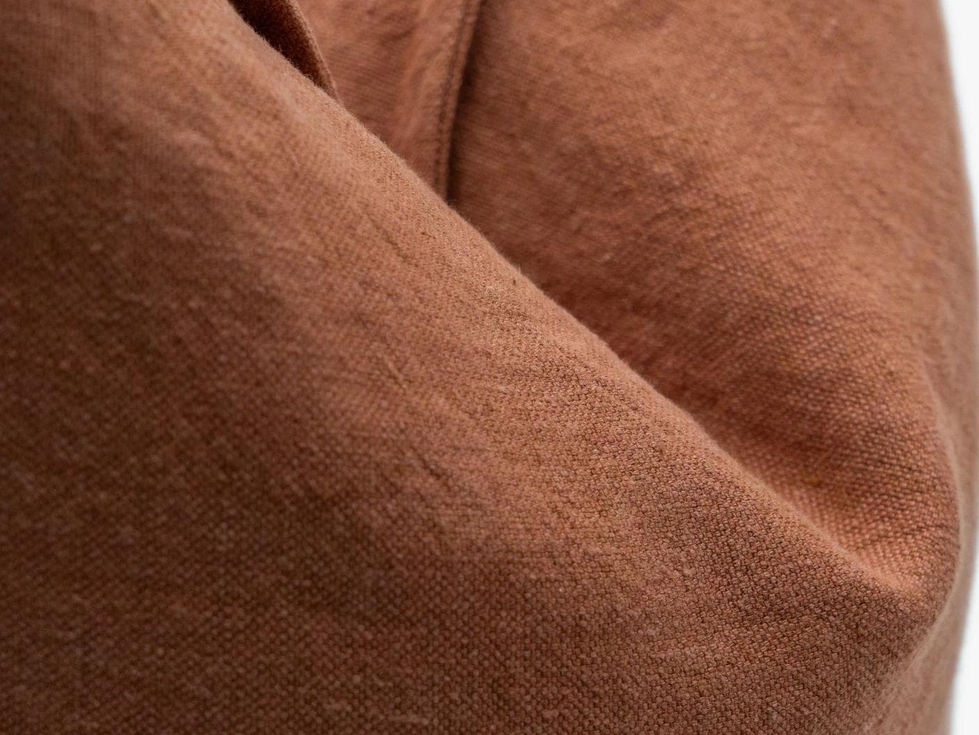 Mel Brick cushion in rust, shown in a product close-up as image 8