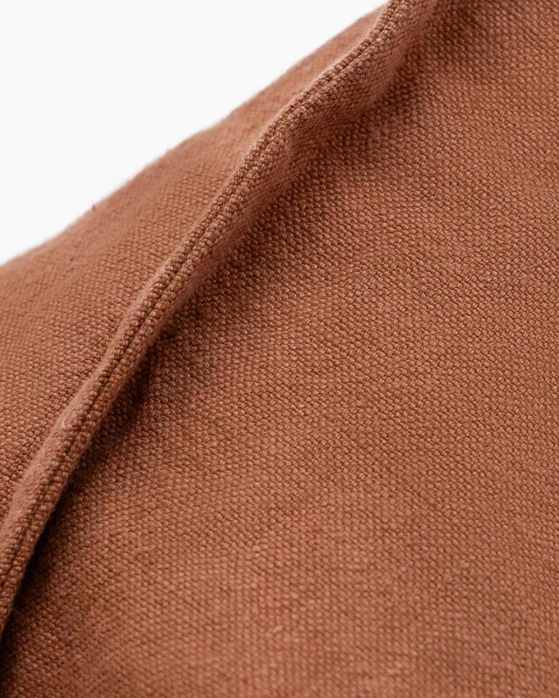 Mel Brick cushion in rust, shown in a product close-up as image 9