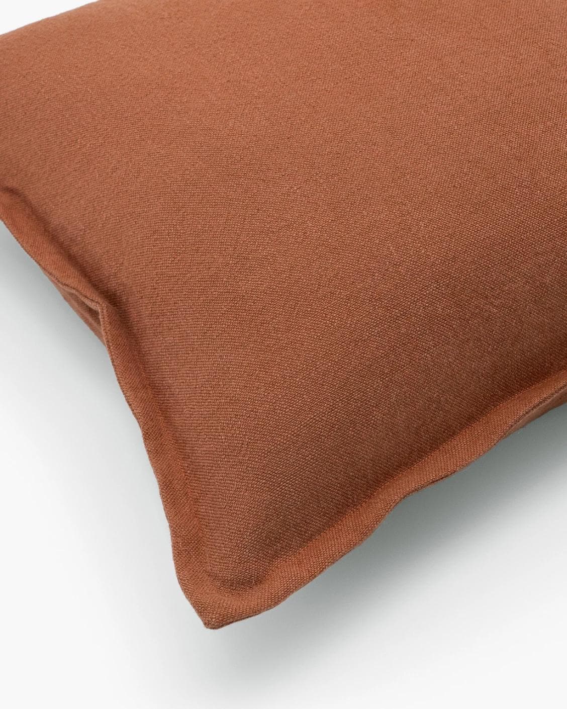 Mel Brick cushion in rust, shown in a product top view as image 10