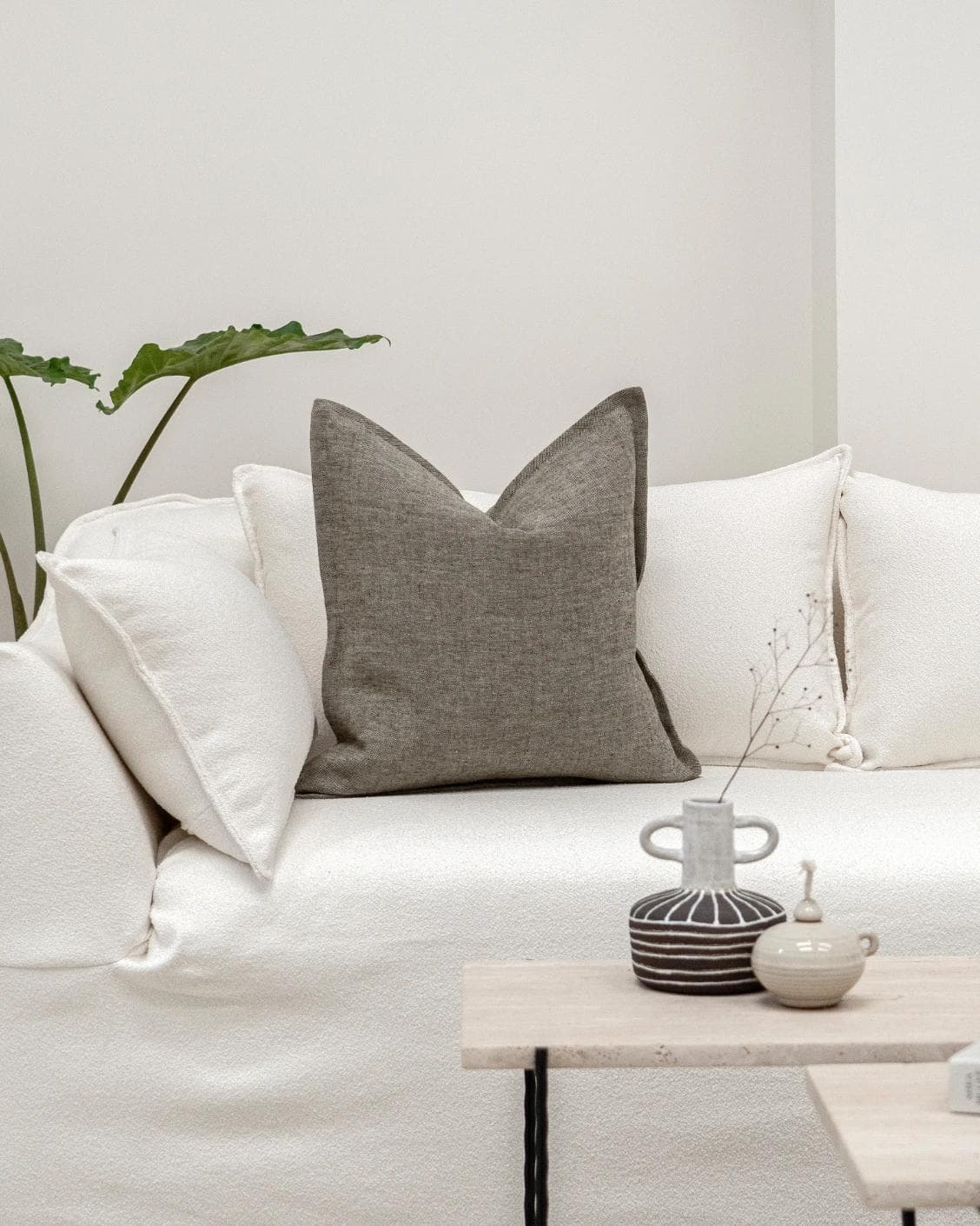 Mel Smoke cushion in linen, grey and charcoal, shown in a lifestyle front view as image 4