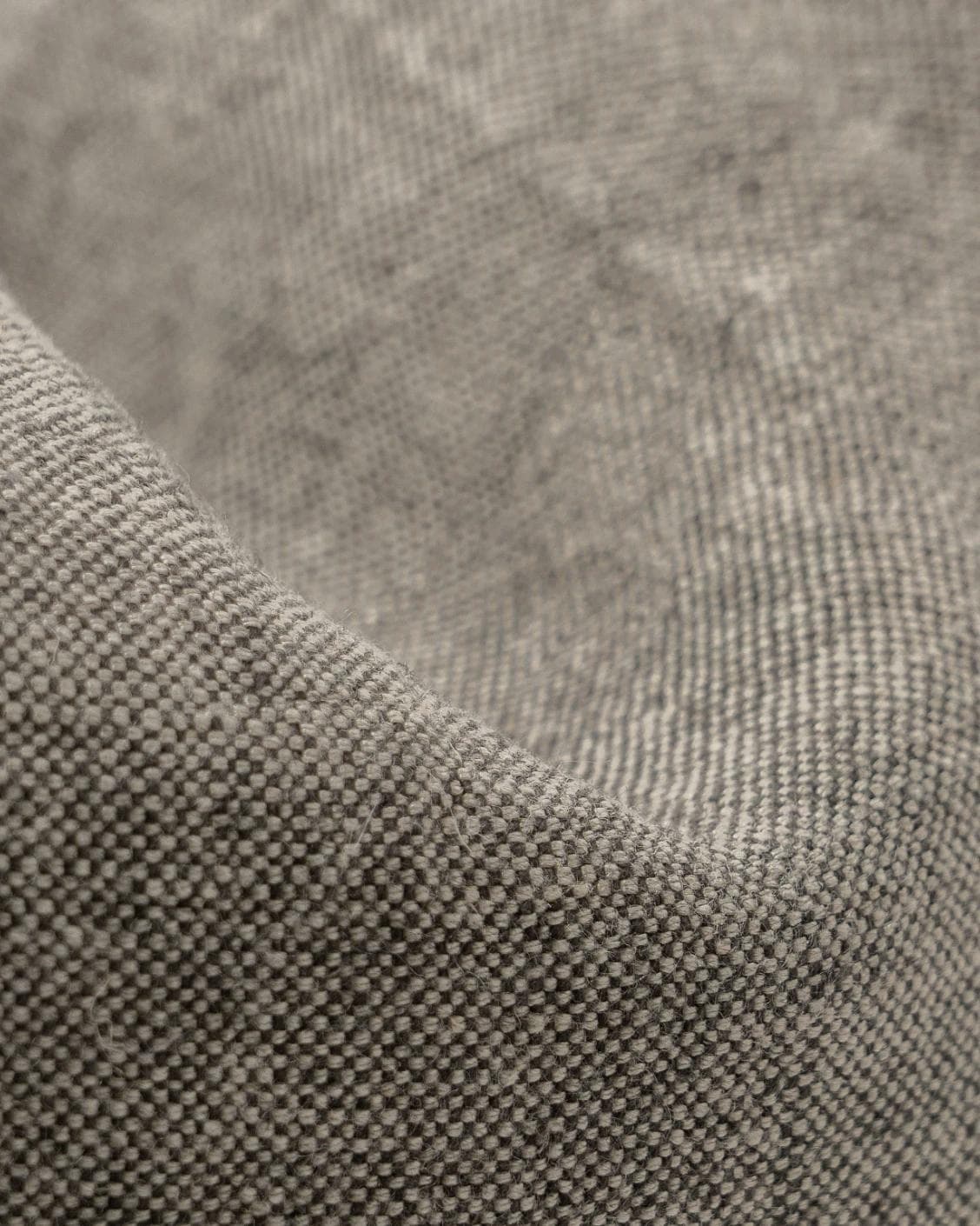 Mel Smoke cushion in linen, grey and charcoal, shown in a product close-up as image 8