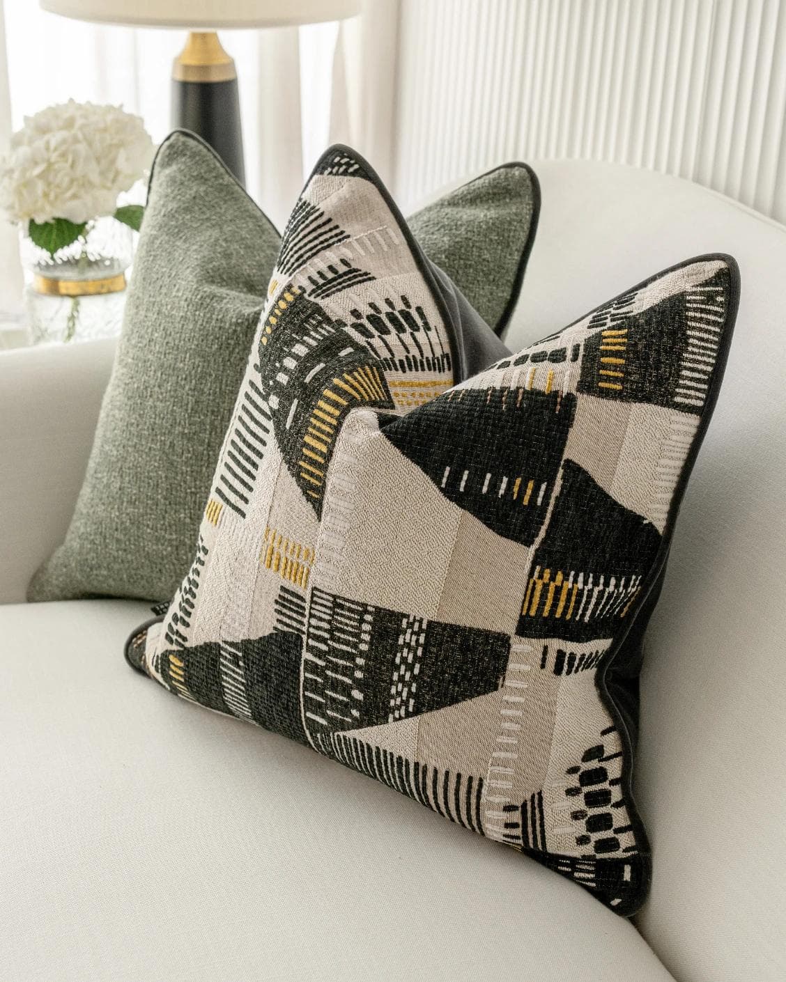 Melaina Bundle cushion in green, black and beige, shown in a lifestyle right view as image 5