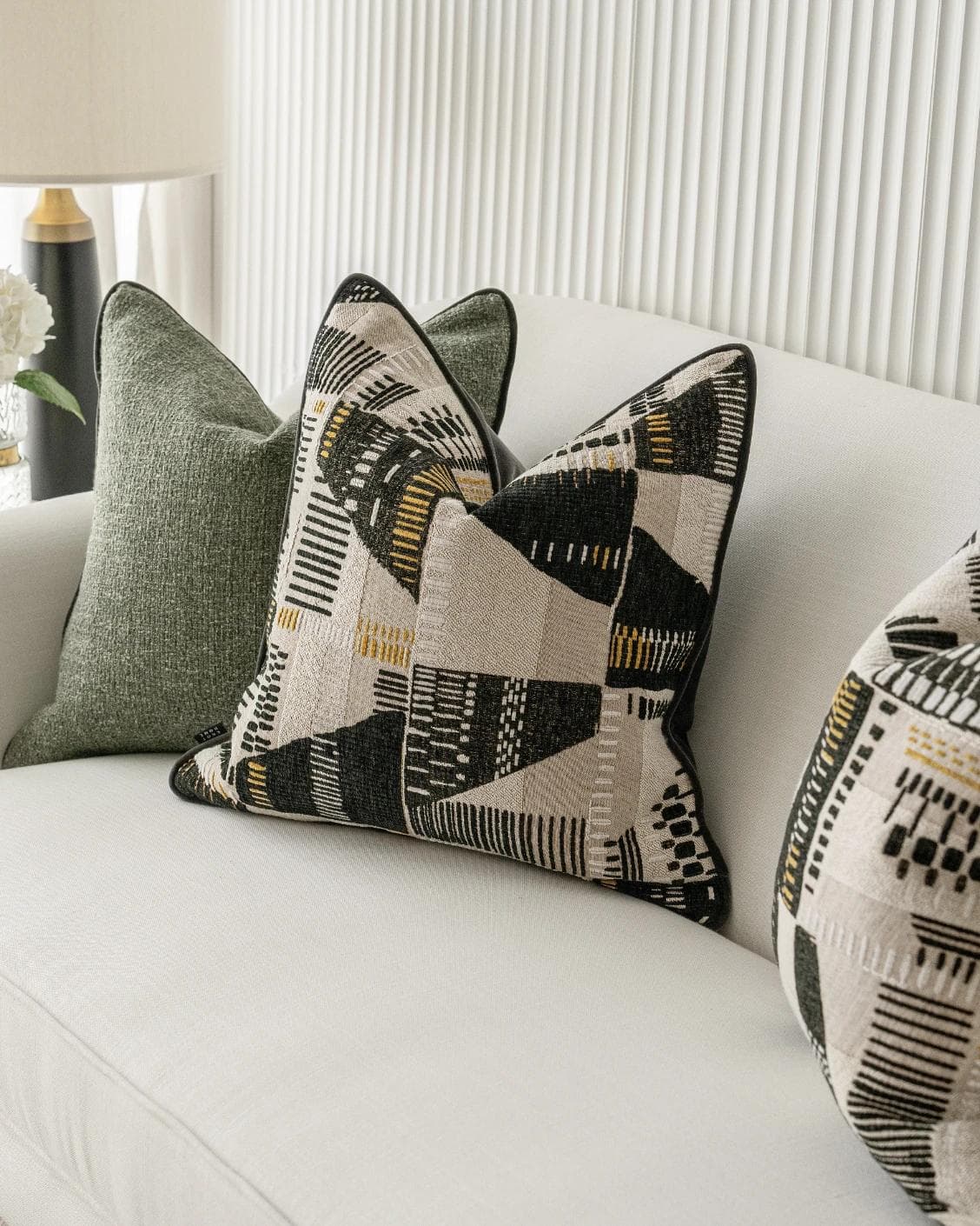 Melaina Bundle cushion in green, black and beige, shown in a product right view as image 6