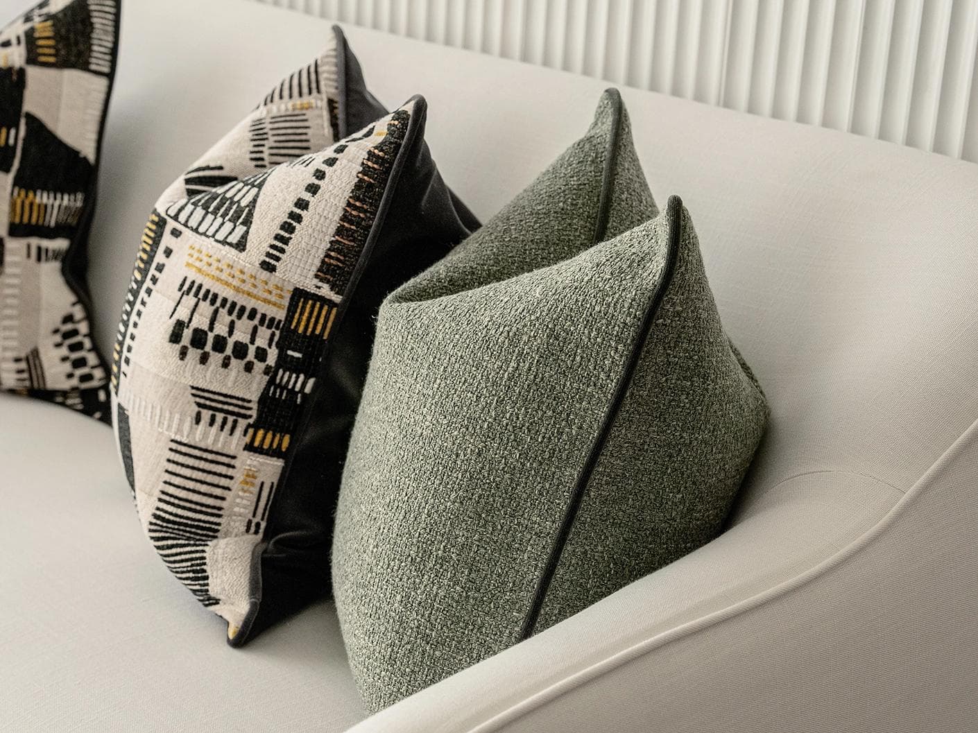 Melaina Bundle cushion in green, black and beige, shown in a product right view as image 7