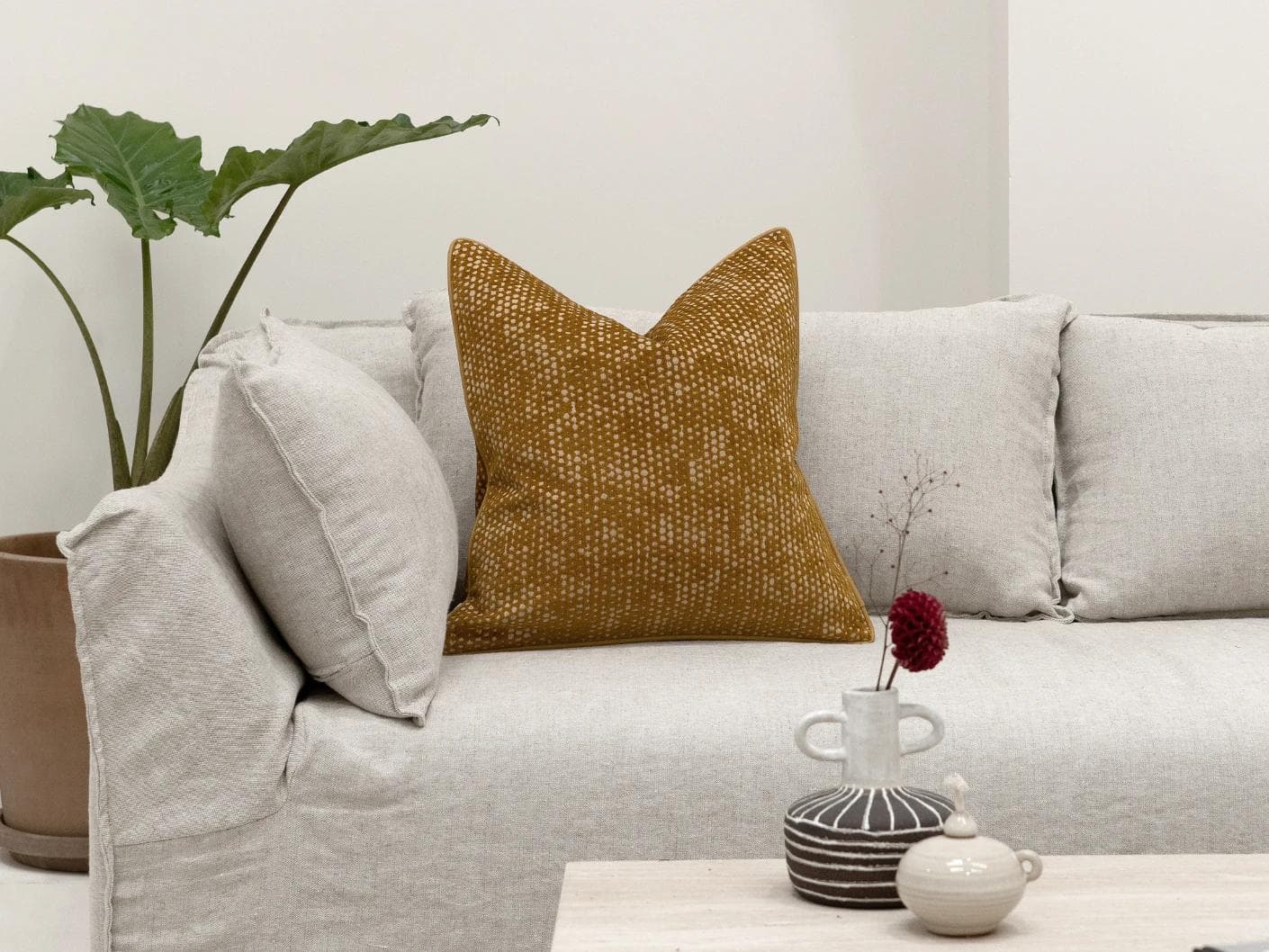 Mercy Barrymore cushion in yellow, shown in a lifestyle front view as image 4
