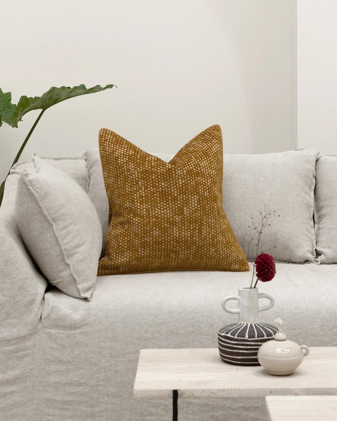 Mercy Barrymore cushion in yellow, shown in a lifestyle front view as image 4