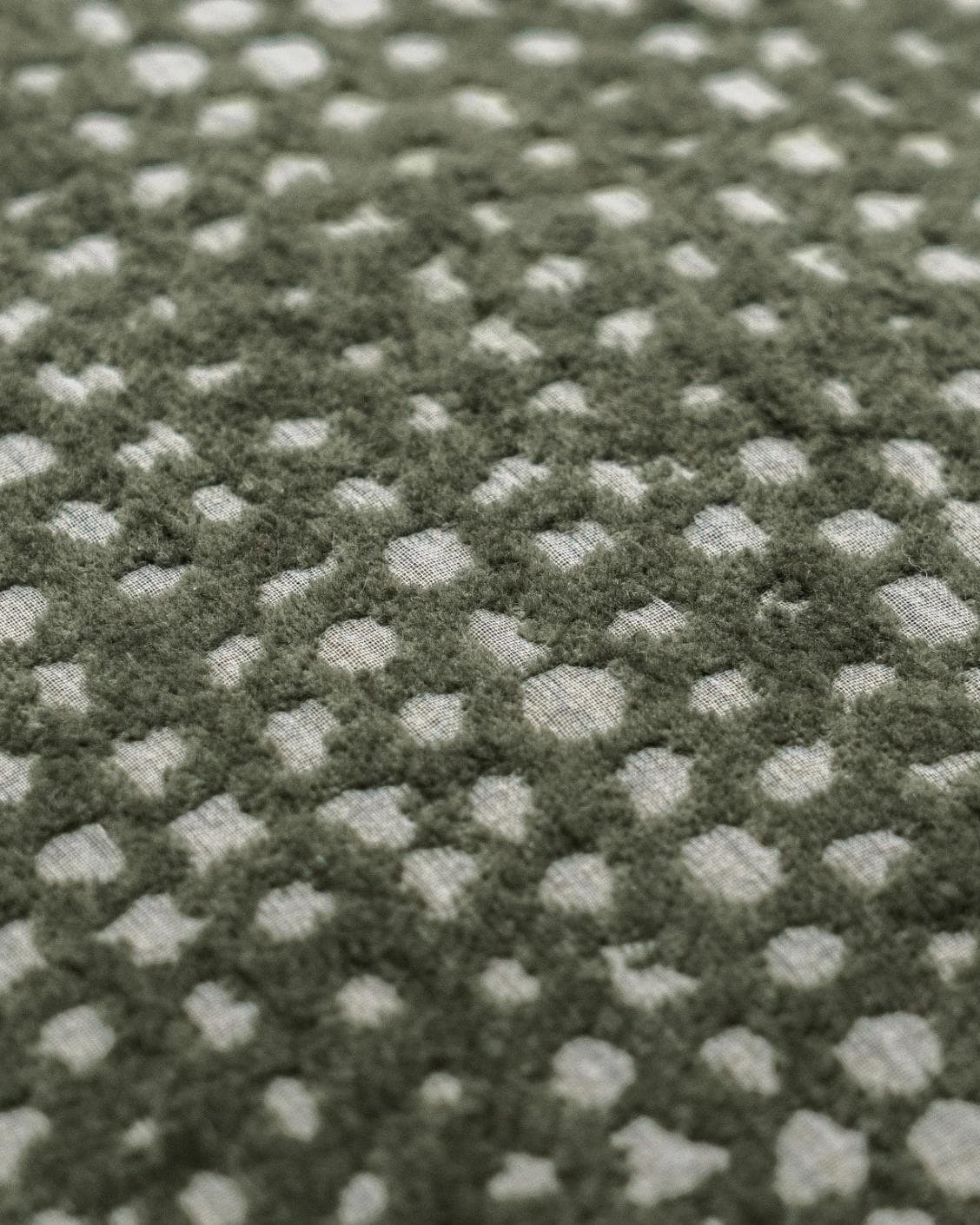 Mercy Sage cushion in green, shown in a product close-up as image 6