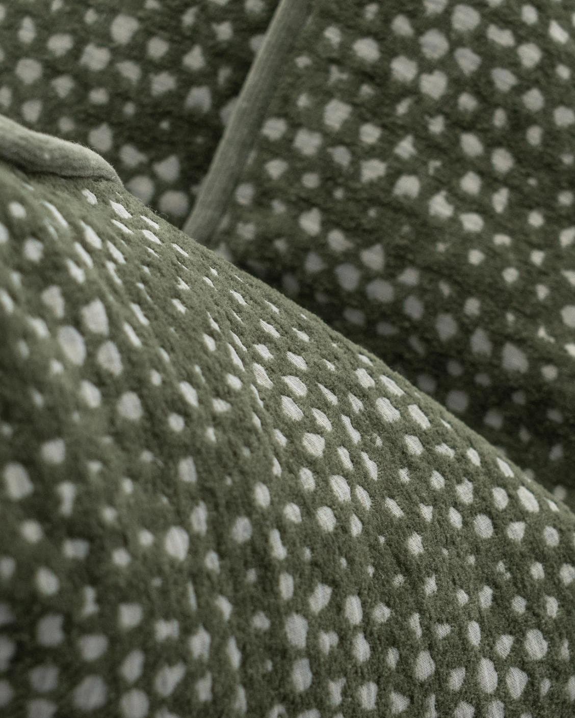 Mercy Sage cushion in green, shown in a product close-up as image 7