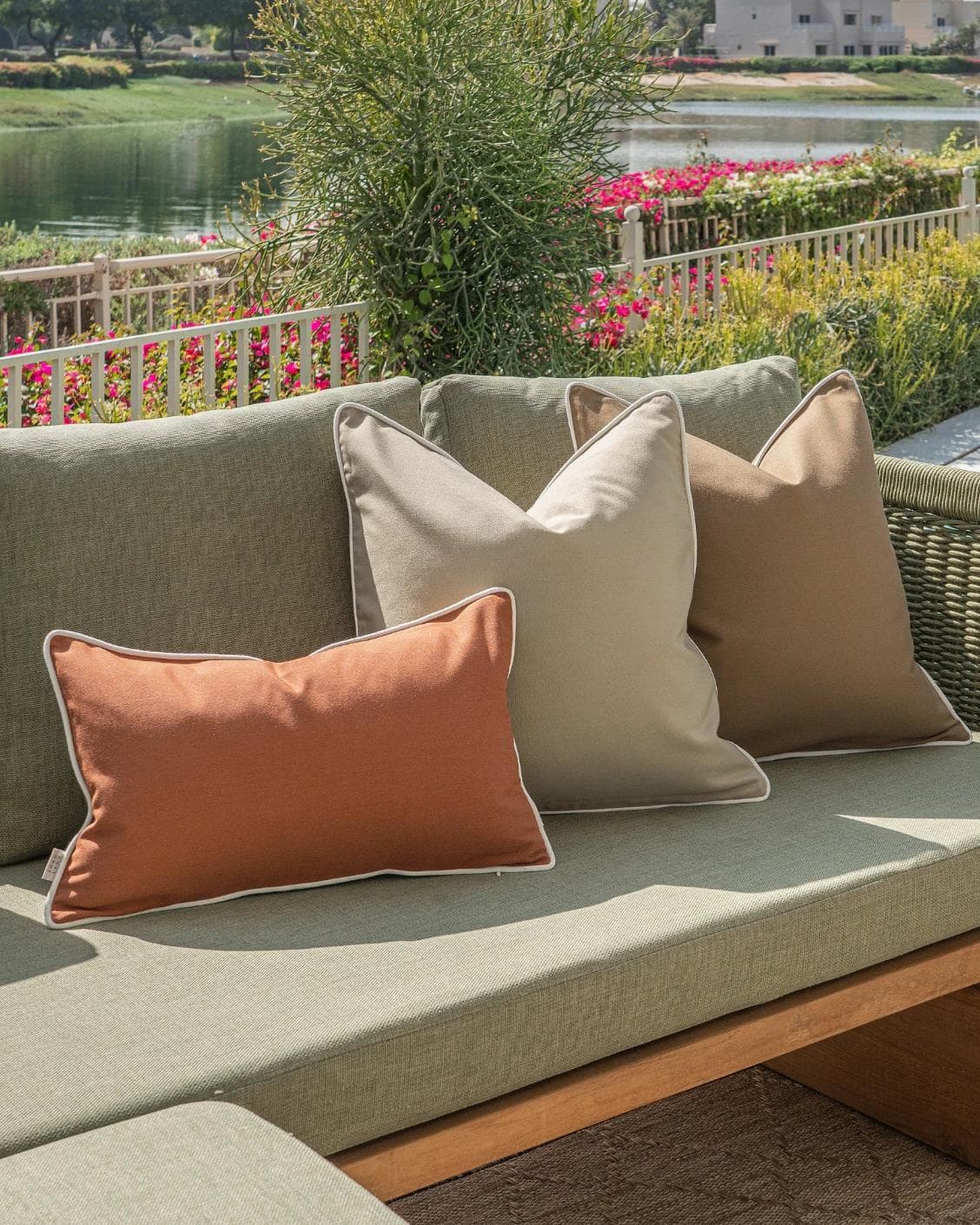 Meryl Bundle cushion in brown and rust, shown in a lifestyle left view as image 2