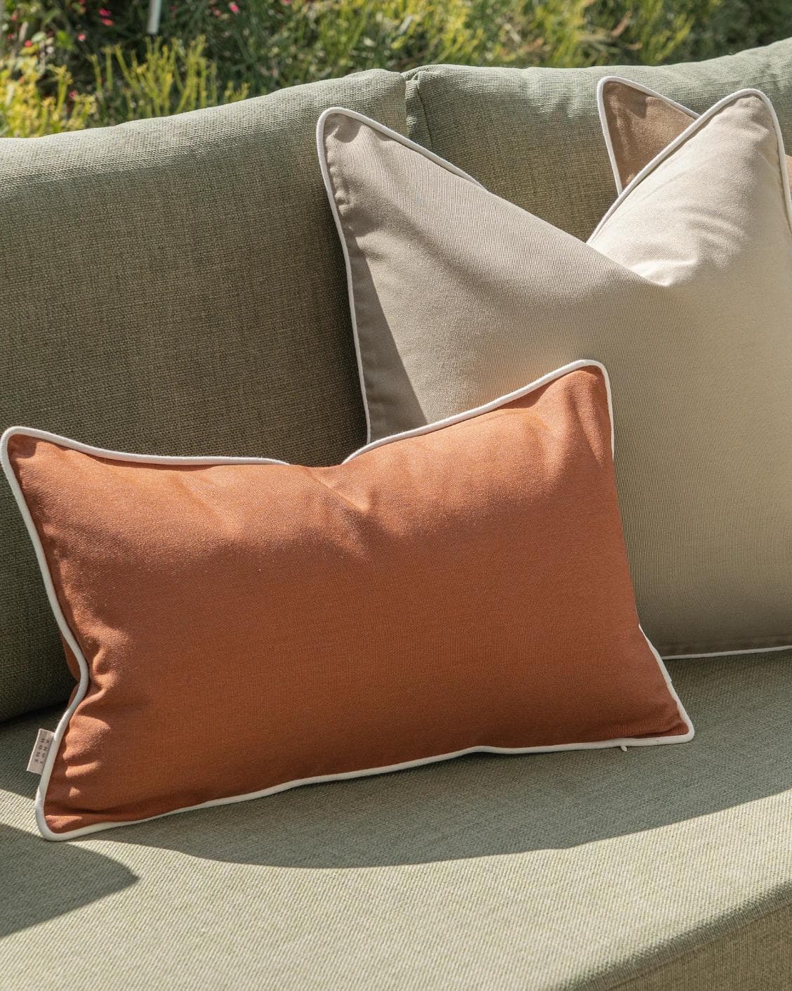 Meryl Bundle cushion in brown and rust, shown in a lifestyle left view as image 5