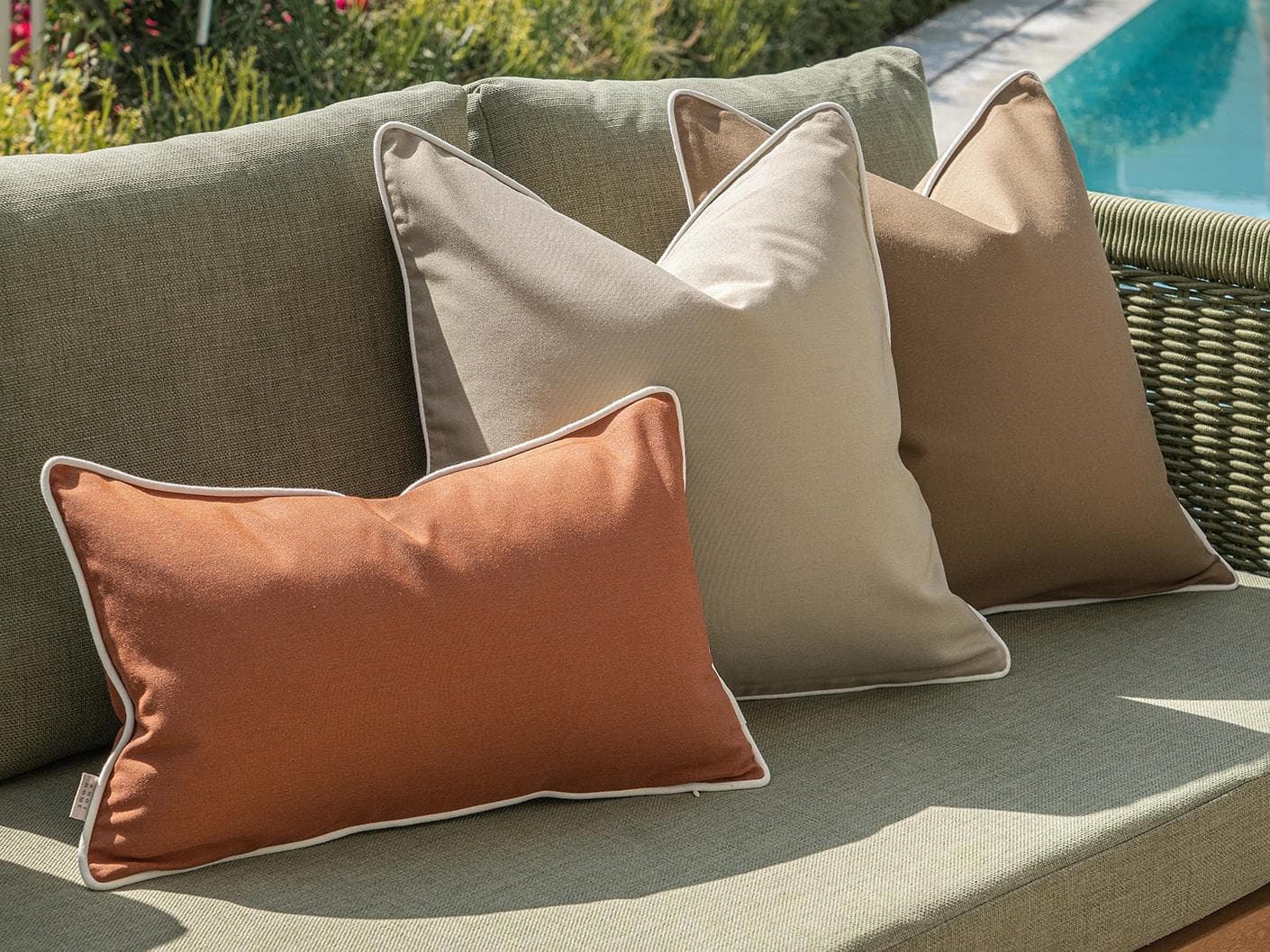 Meryl Bundle cushion in brown and rust, shown in a lifestyle left view as image 5
