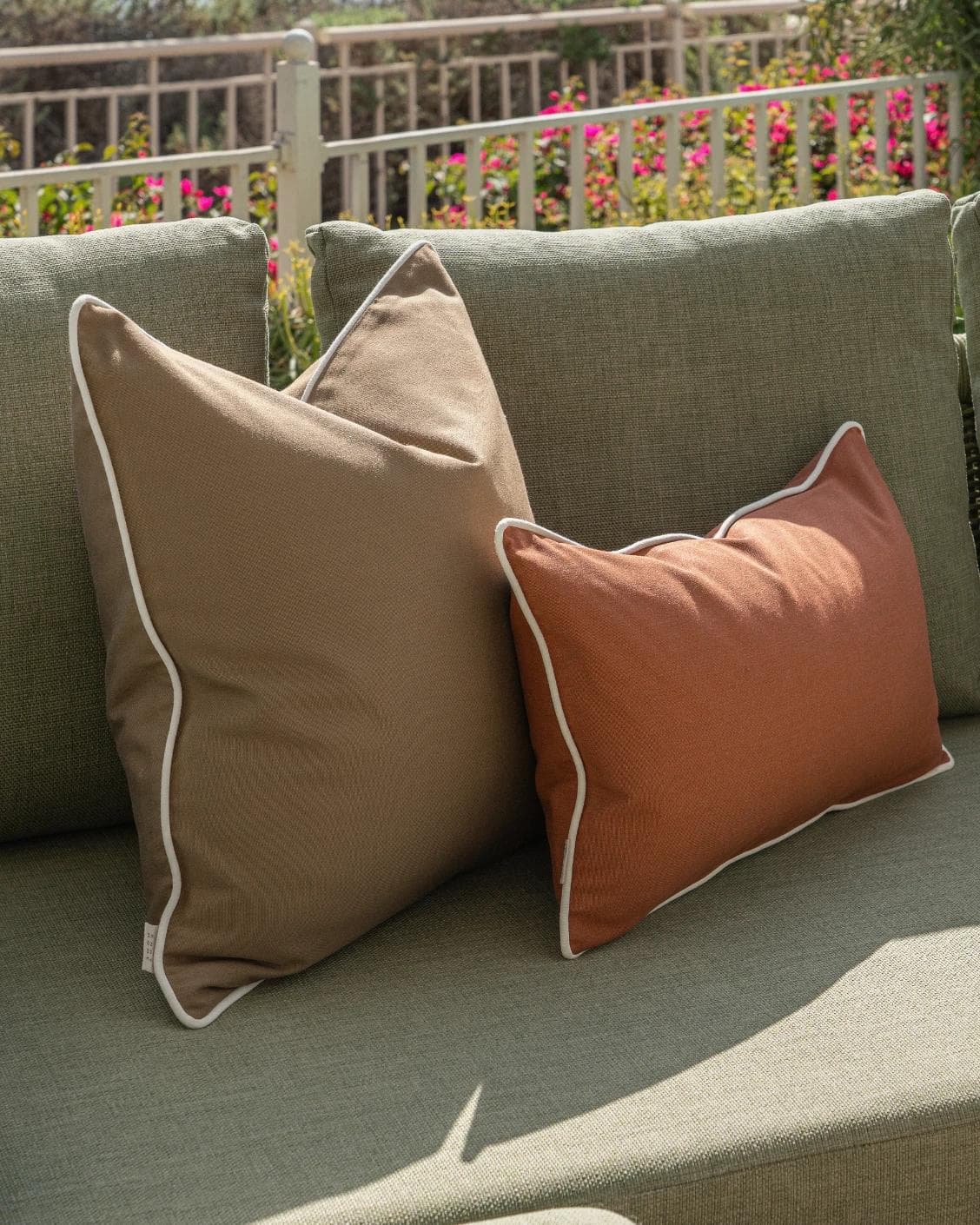 Meryl Bundle cushion in brown and rust, shown in a lifestyle left view as image 6