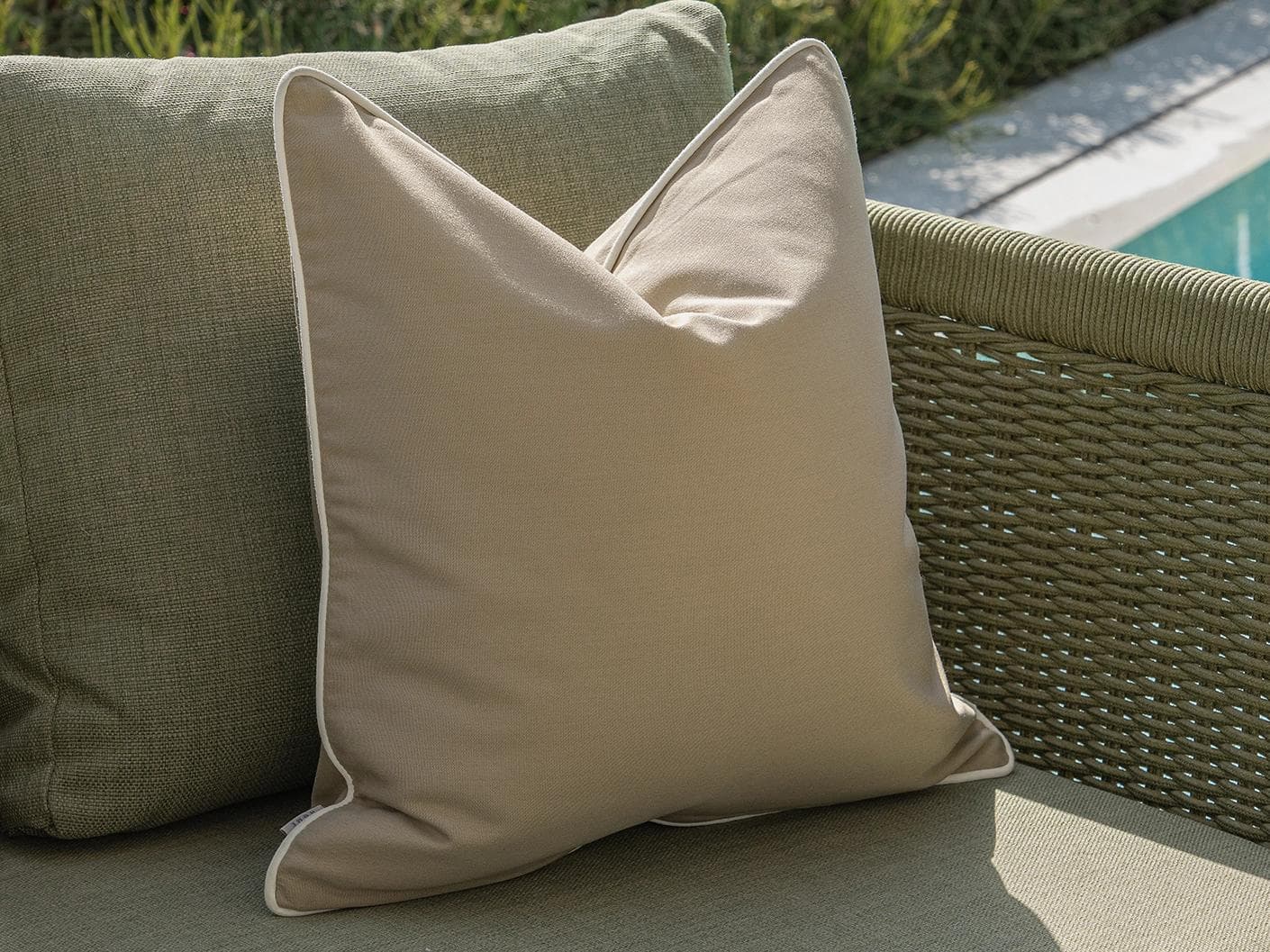 Meryl Bundle cushion in brown and rust, shown in a lifestyle left view as image 7