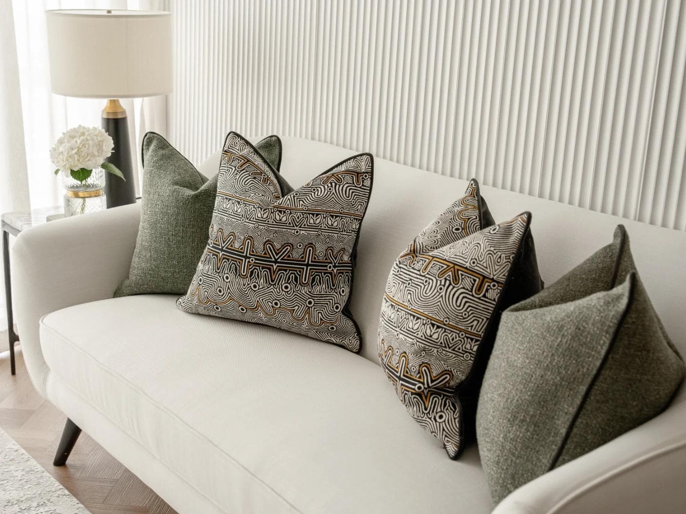 Mika Bundle cushion in black, silver and green, shown in a lifestyle right view as image 5