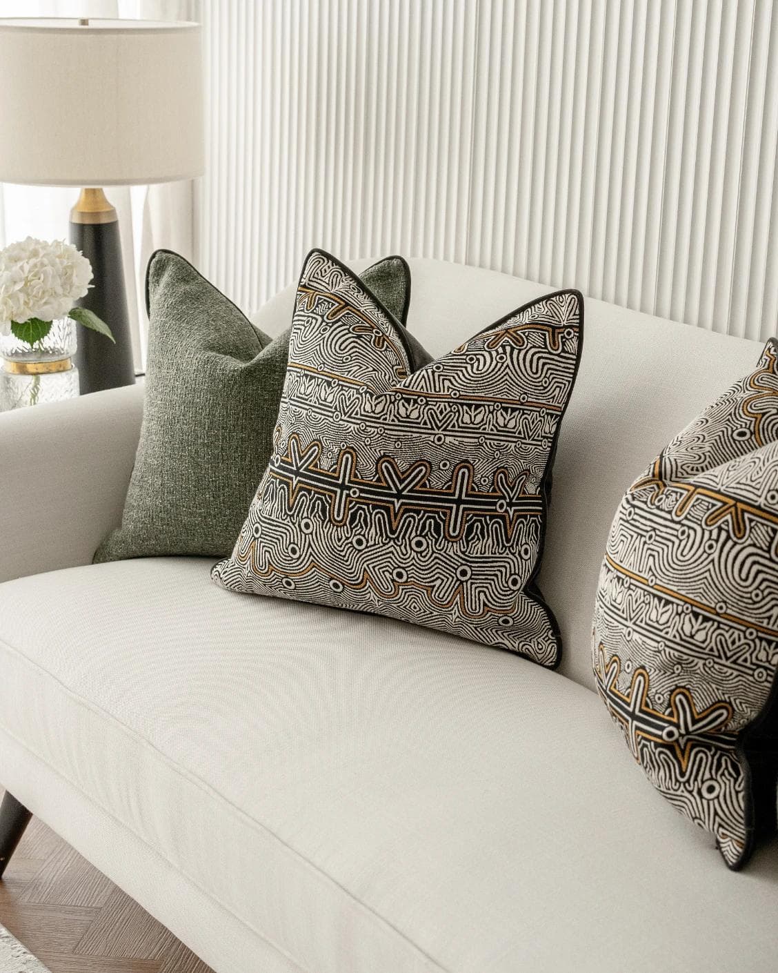 Mika Bundle cushion in black, silver and green, shown in a lifestyle right view as image 5