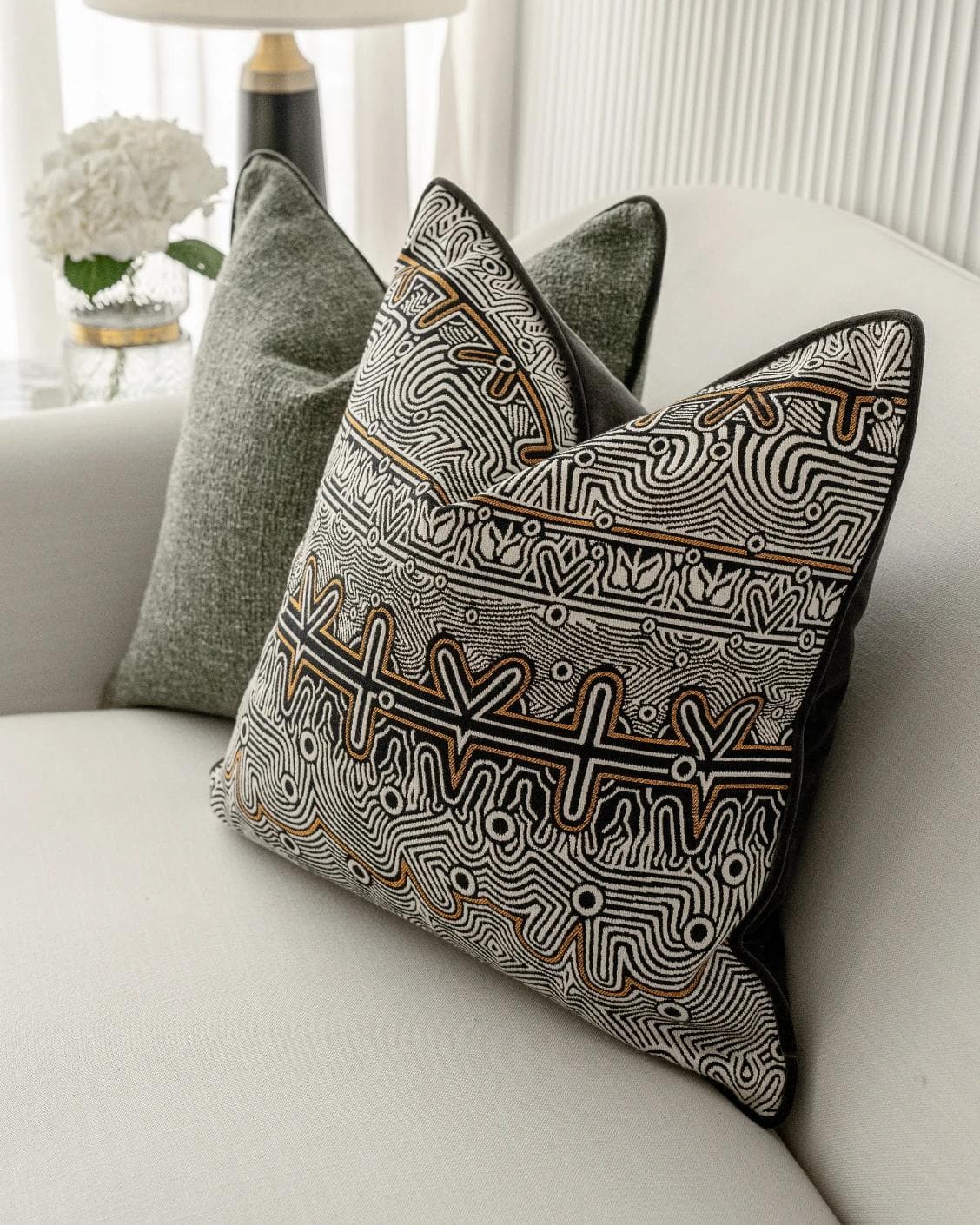 Mika Bundle cushion in black, silver and green, shown in a lifestyle right view as image 6