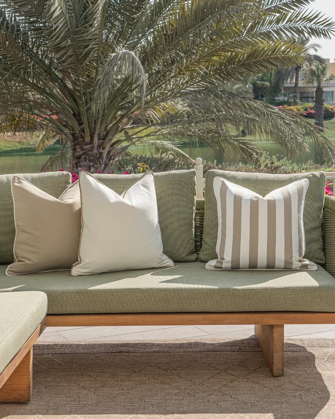 Miko Bundle cushion in brown, ivory and beige, shown in a lifestyle front view as image 4