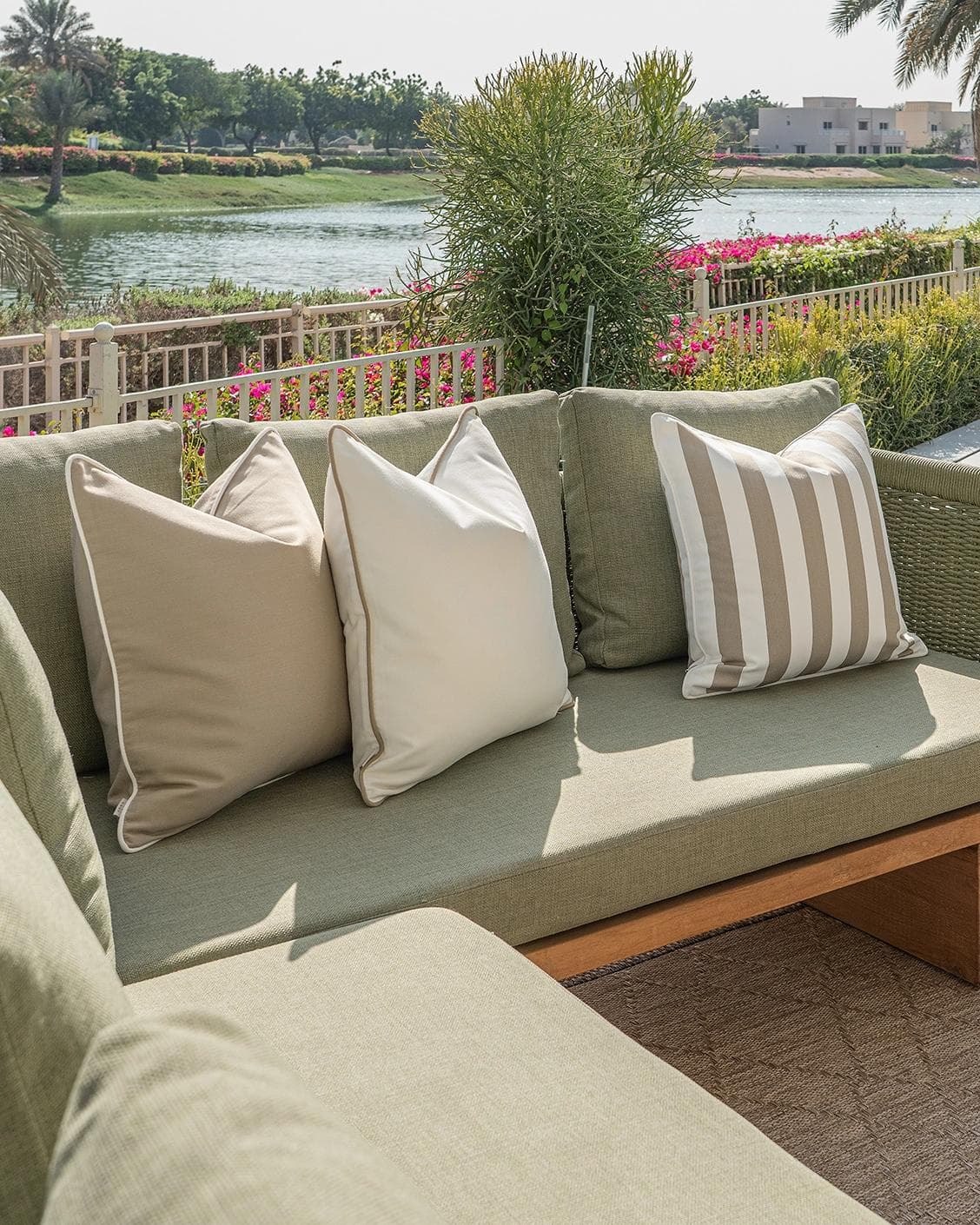 Miko Bundle cushion in brown, ivory and beige, shown in a lifestyle left view as image 2