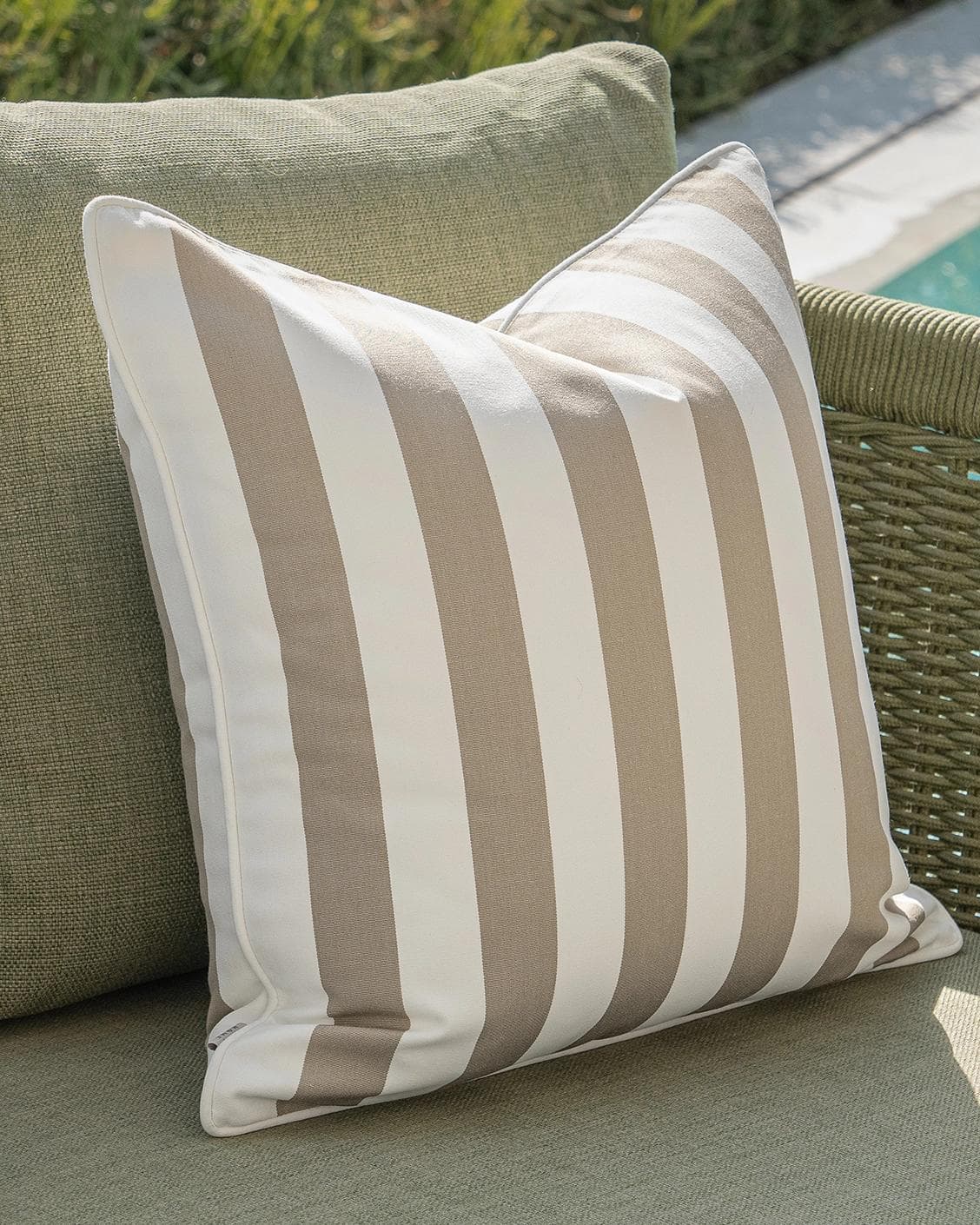 Miko Bundle cushion in brown, ivory and beige, shown in a lifestyle left view as image 7