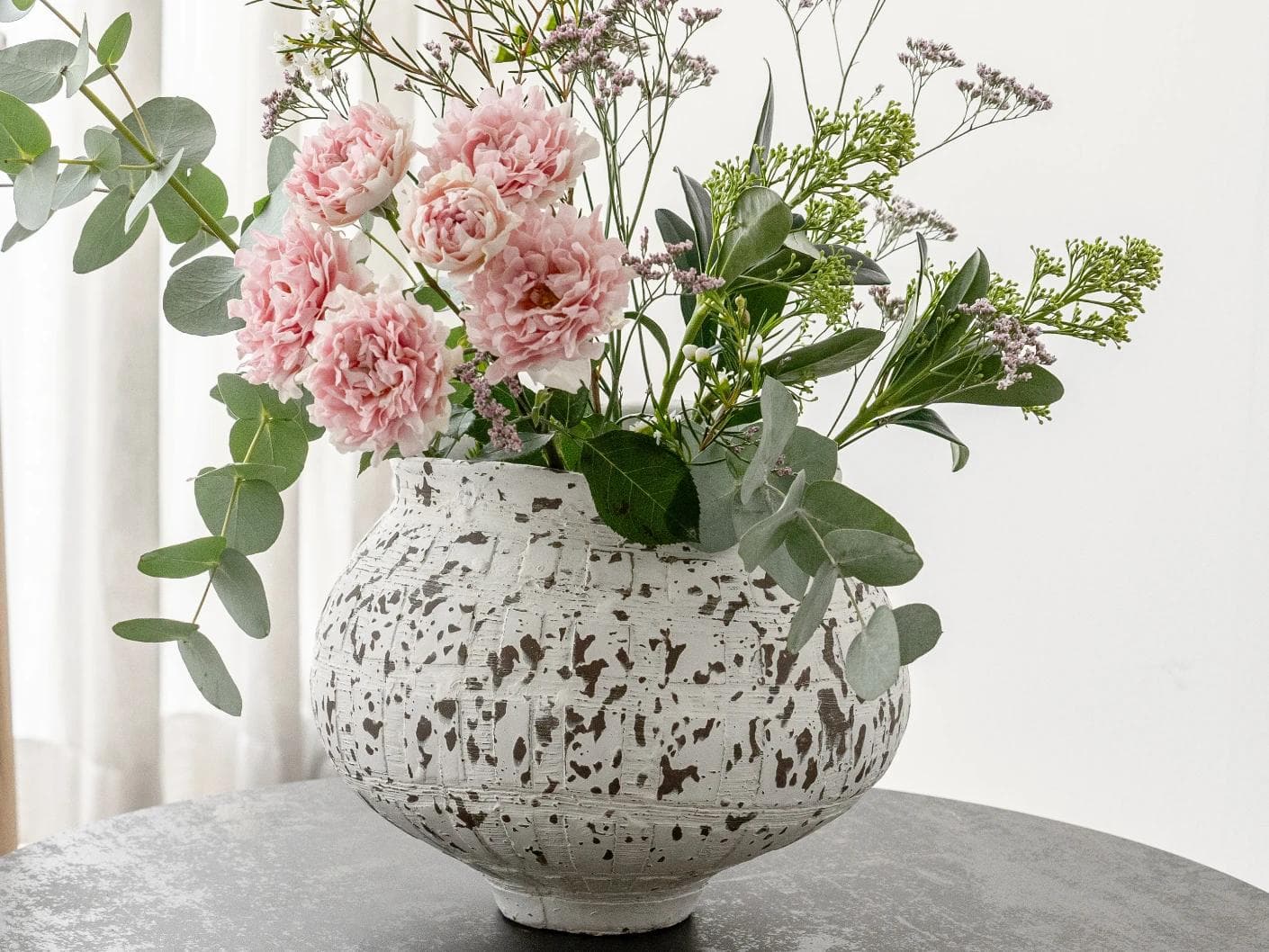 Miraflora Arneson vases in white and grey, shown in a lifestyle front view as image 6