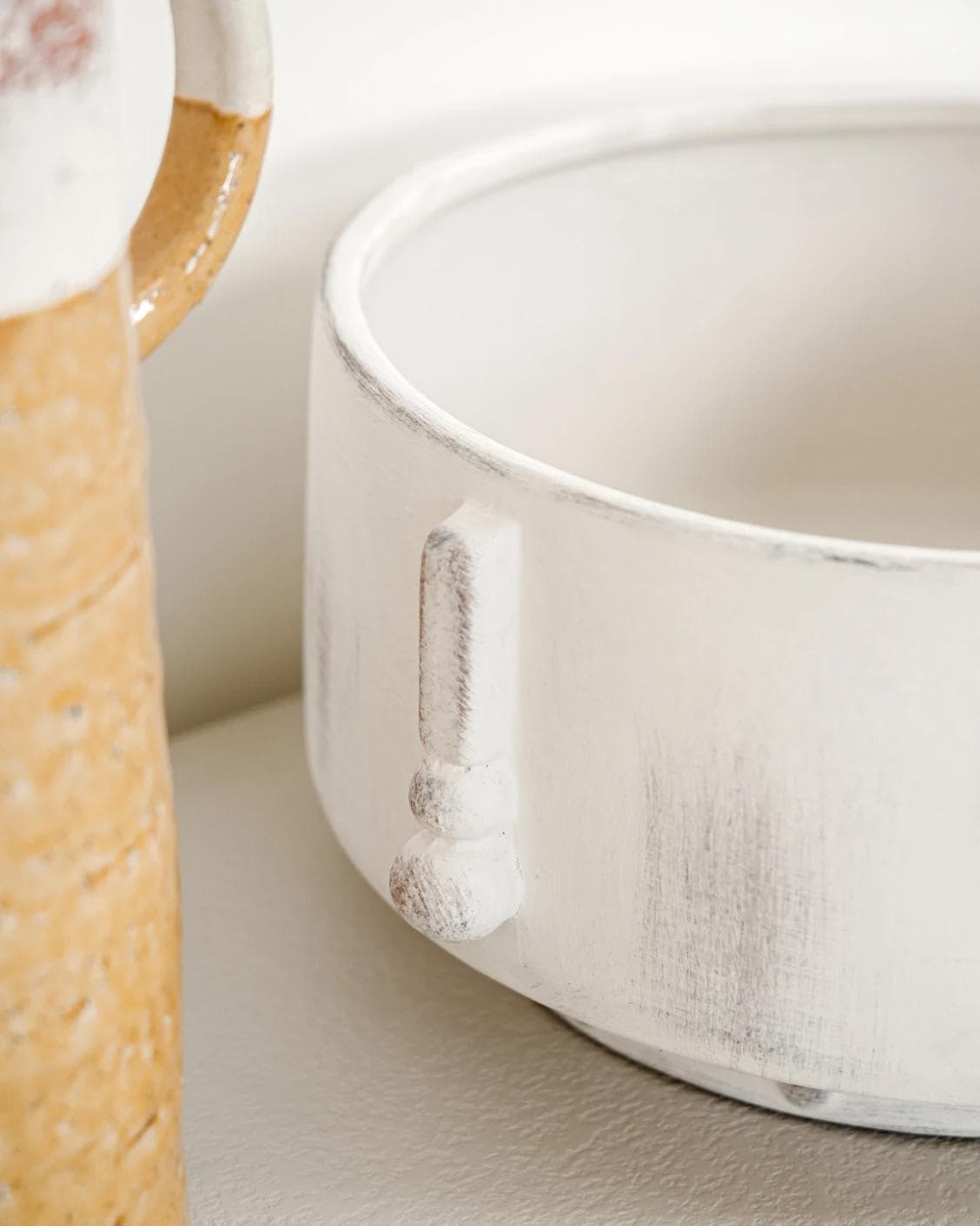 Misha Terra bowls in ivory and white, shown in a lifestyle close-up top view as image 5