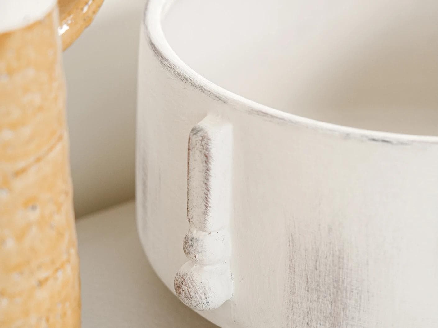 Misha Terra bowls in ivory and white, shown in a lifestyle close-up top view as image 5