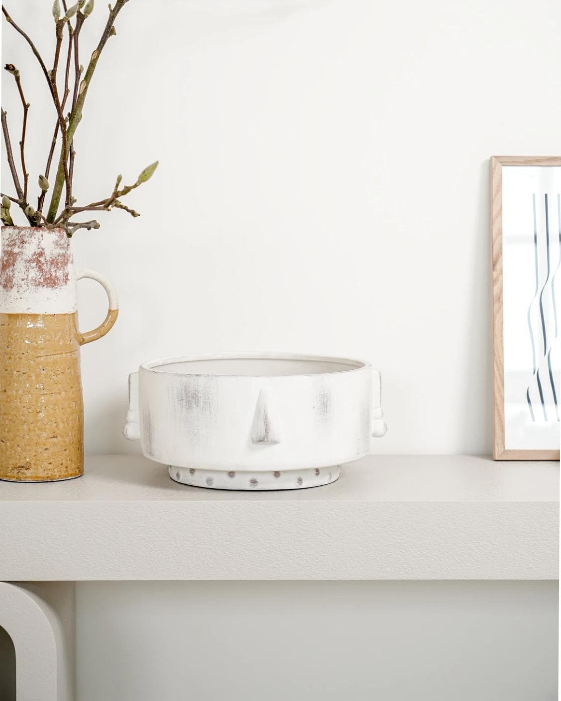 Misha Terra bowls in ivory and white, shown in a lifestyle front view as image 6