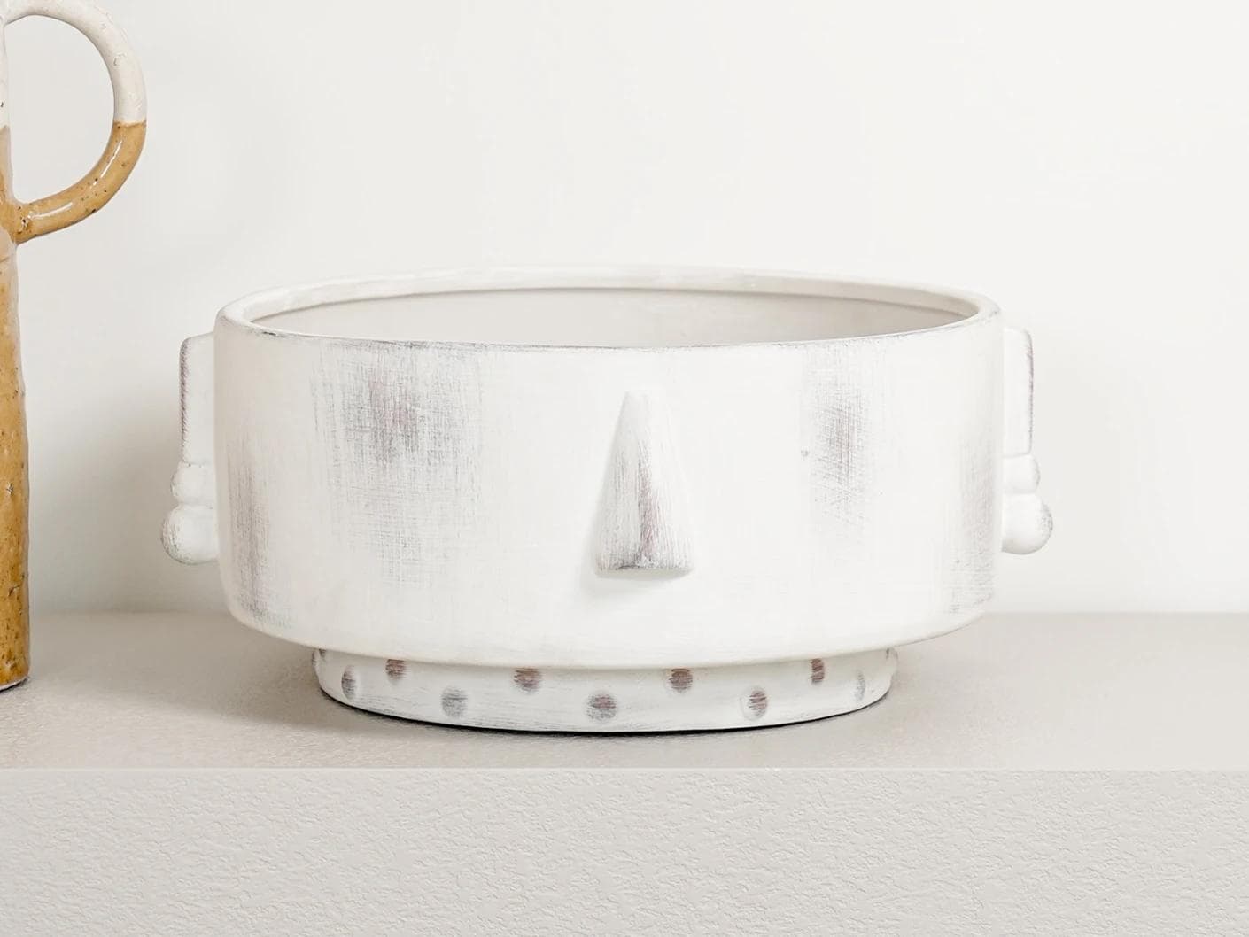 Misha Terra bowls in ivory and white, shown in a lifestyle front view as image 6