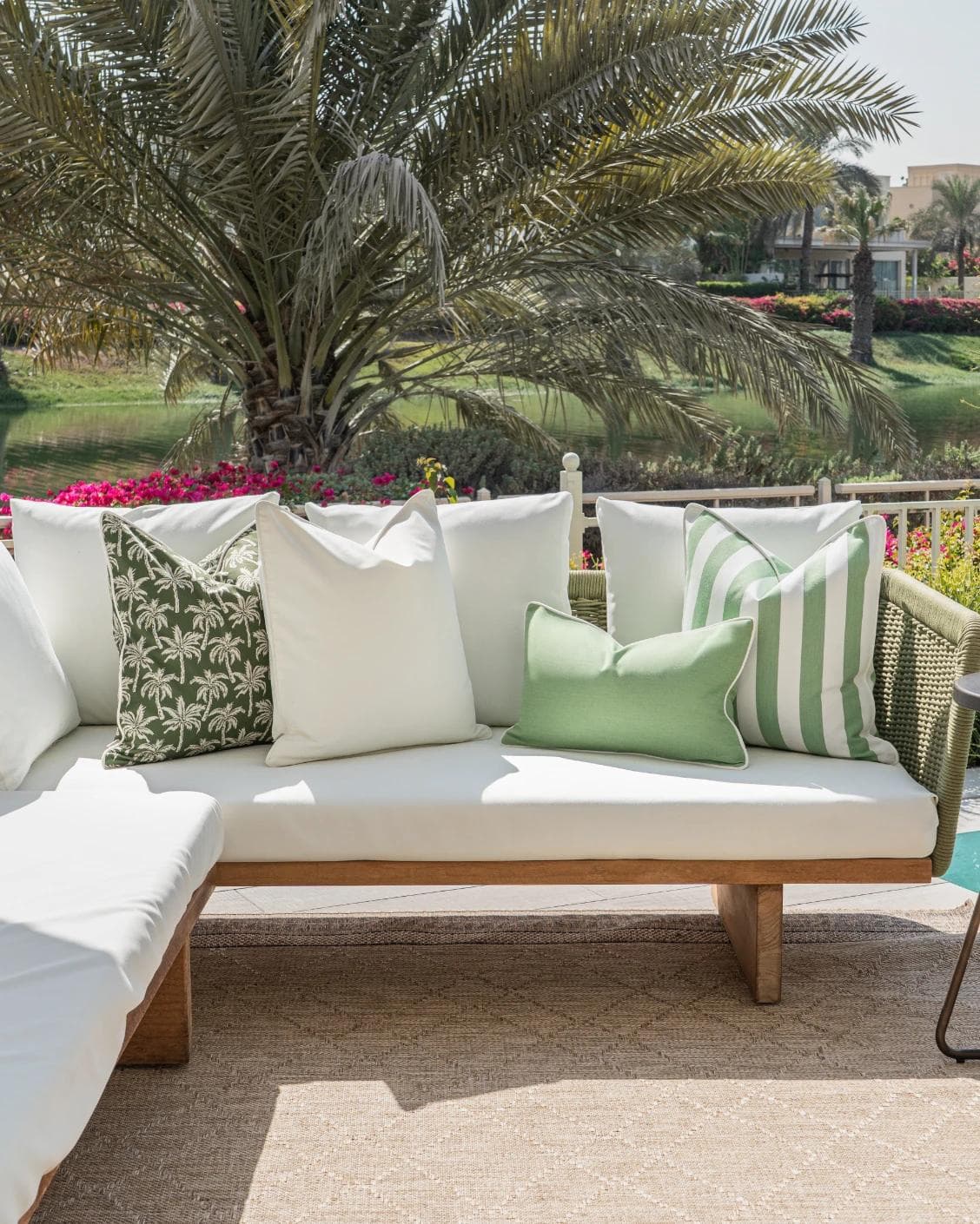 Mysha Bundle cushion in ivory and green, shown in a lifestyle front view as image 4