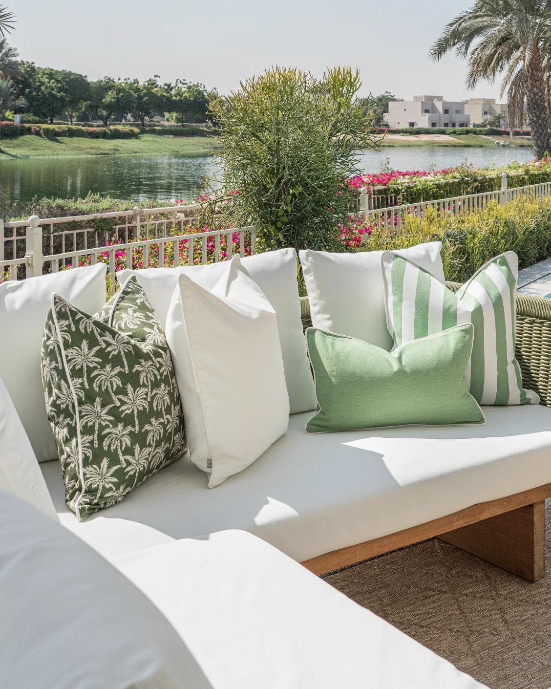 Mysha Bundle cushion in ivory and green, shown in a lifestyle left view as image 2