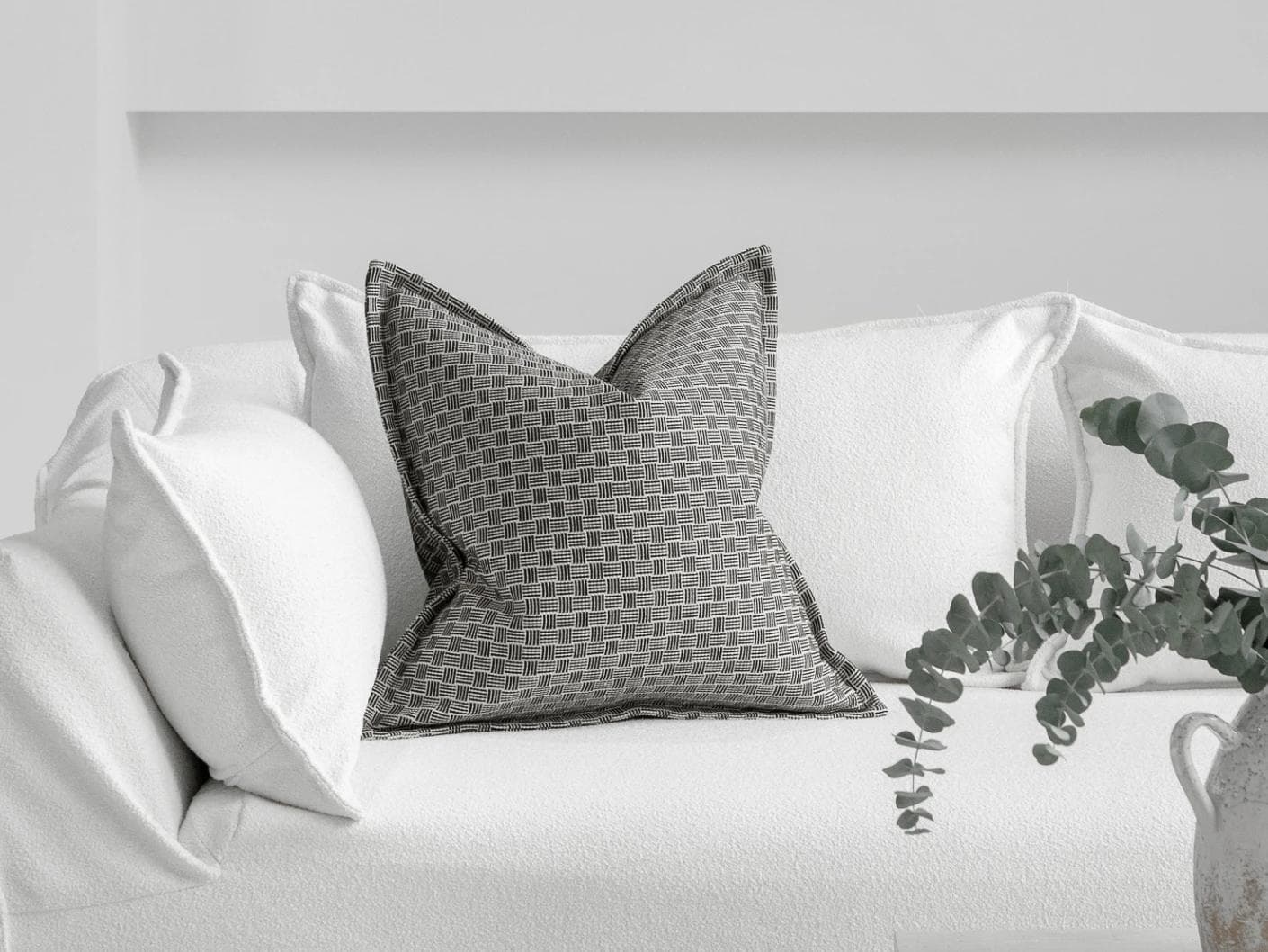 Naomi Steele cushion in grey, shown in a lifestyle front view as image 4