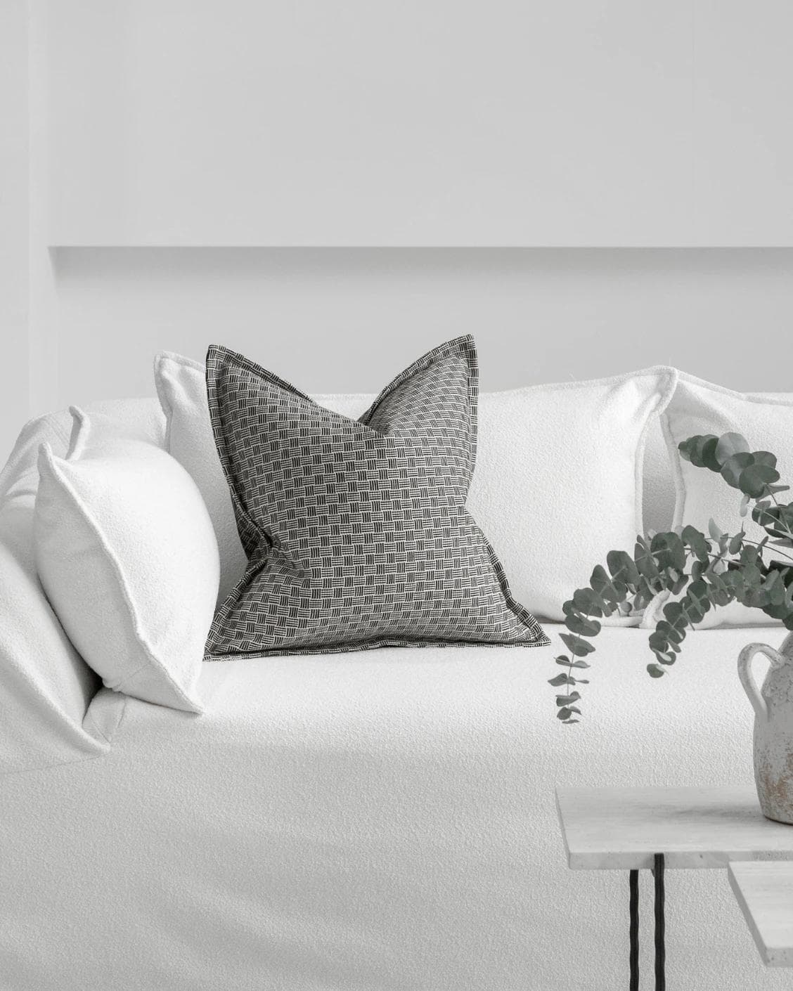 Naomi Steele cushion in grey, shown in a lifestyle front view as image 4
