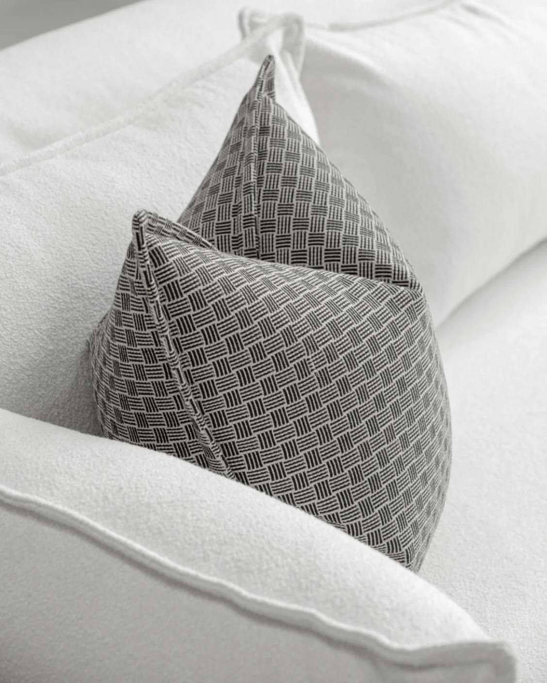 Naomi Steele cushion in grey, shown in a lifestyle top view as image 5