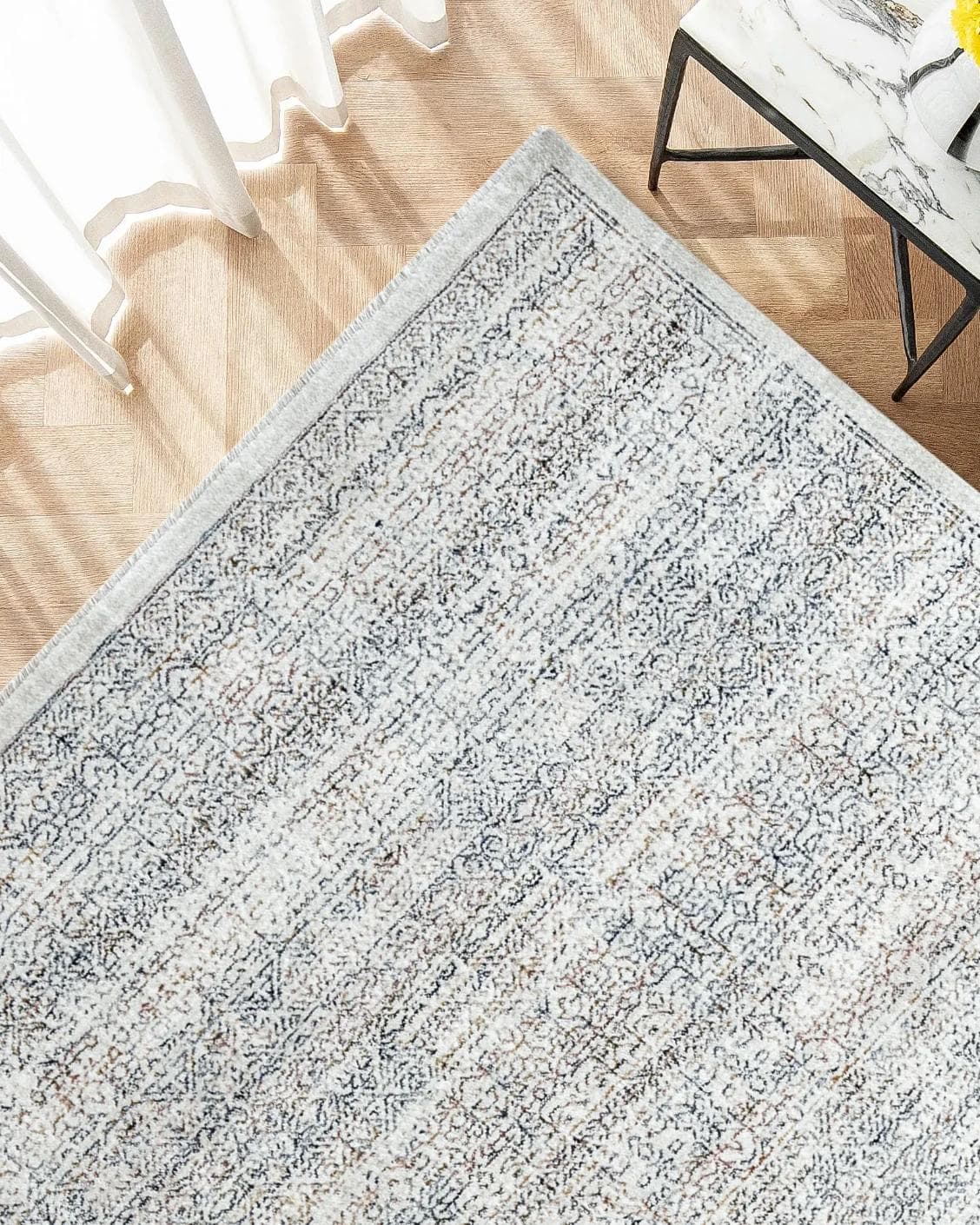 Natalia Azure carpet in blue and grey, shown in a lifestyle top view as image 2