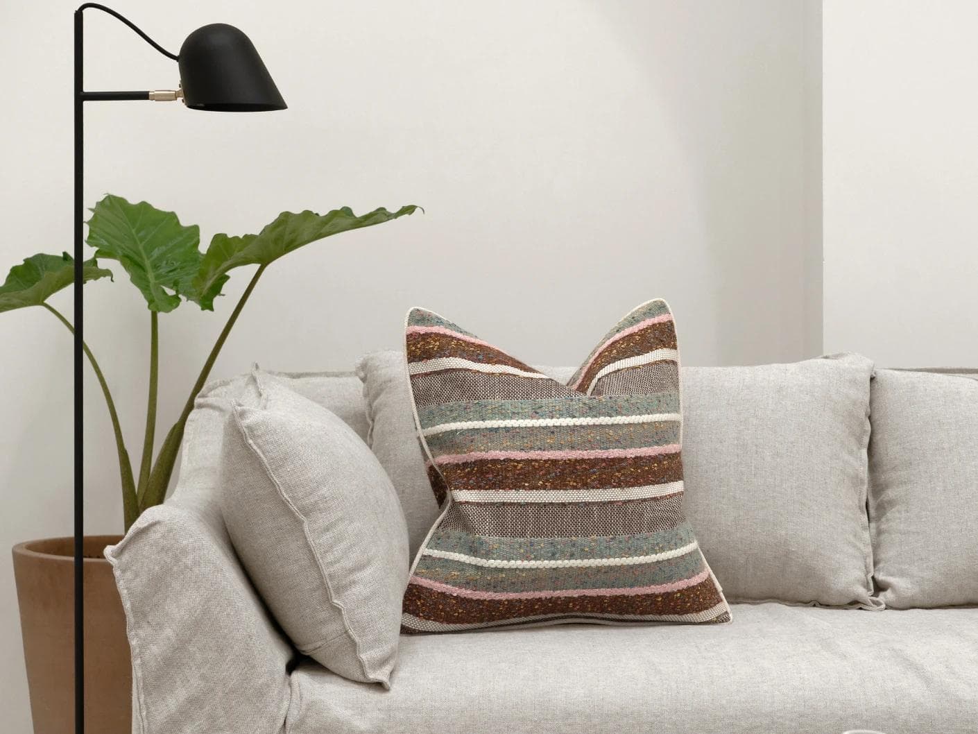 Naysa Alecia cushion in multicolour, shown in a lifestyle front view as image 4