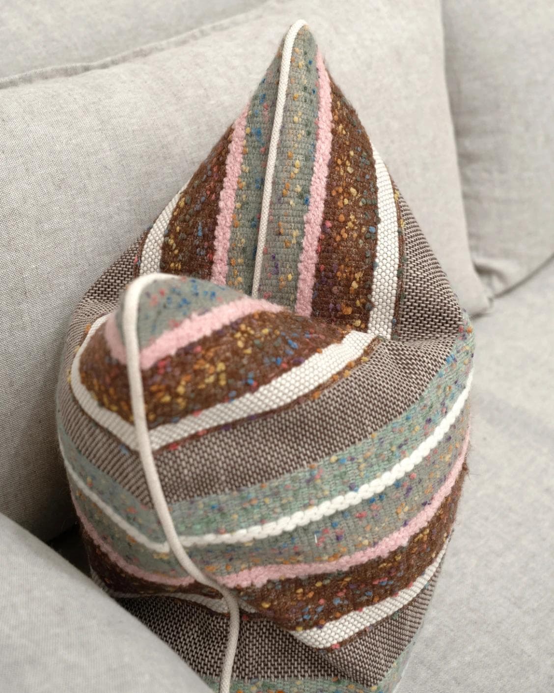 Naysa Alecia cushion in multicolour, shown in a lifestyle top view as image 5