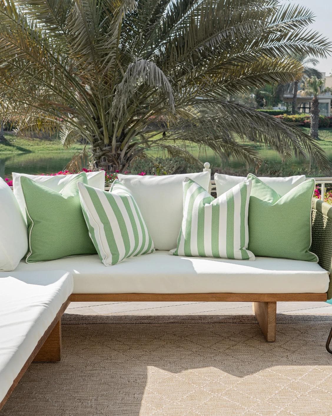 Nehal Bundle cushion in green, shown in a lifestyle front view as image 4