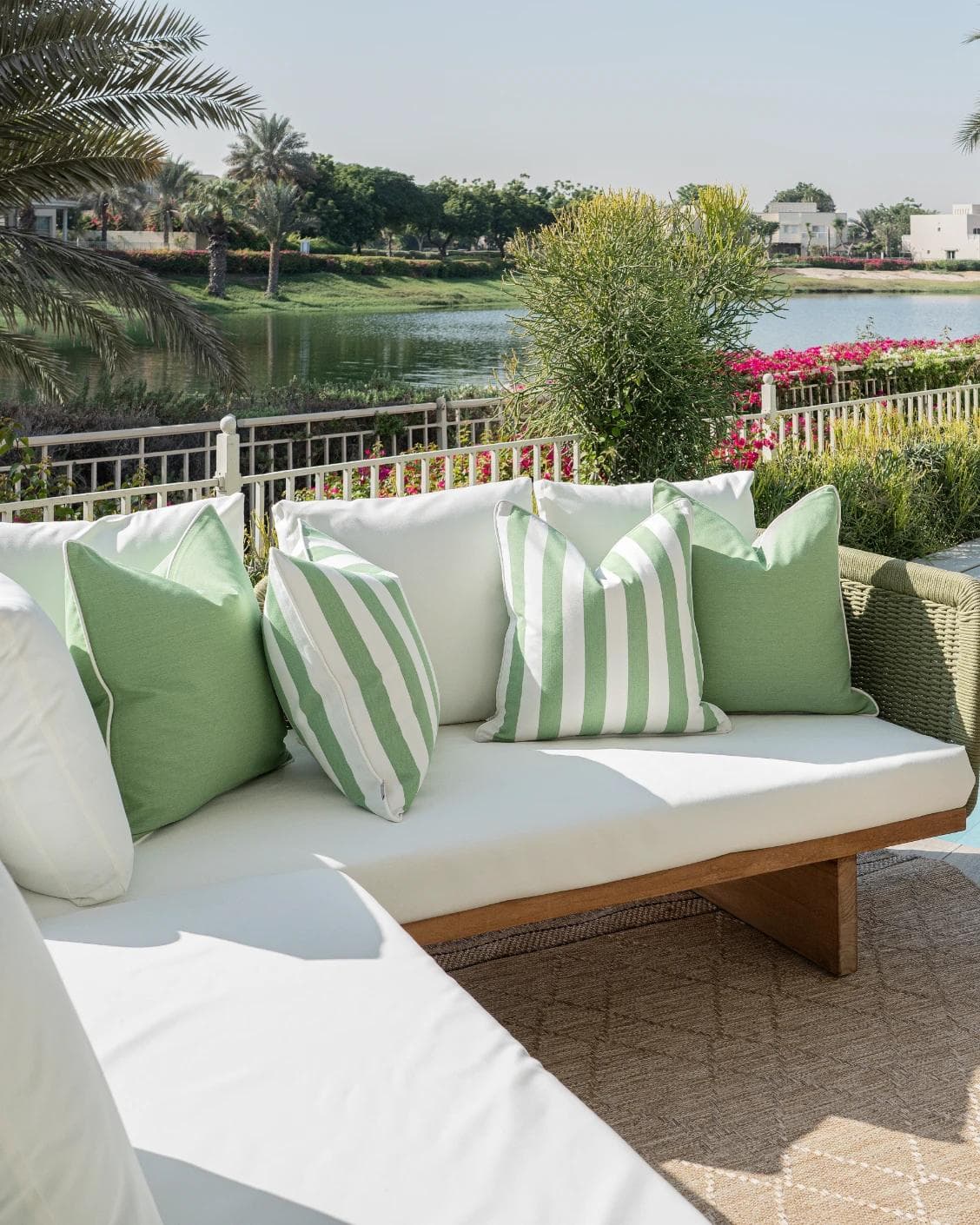Nehal Bundle cushion in green, shown in a lifestyle left view as image 2