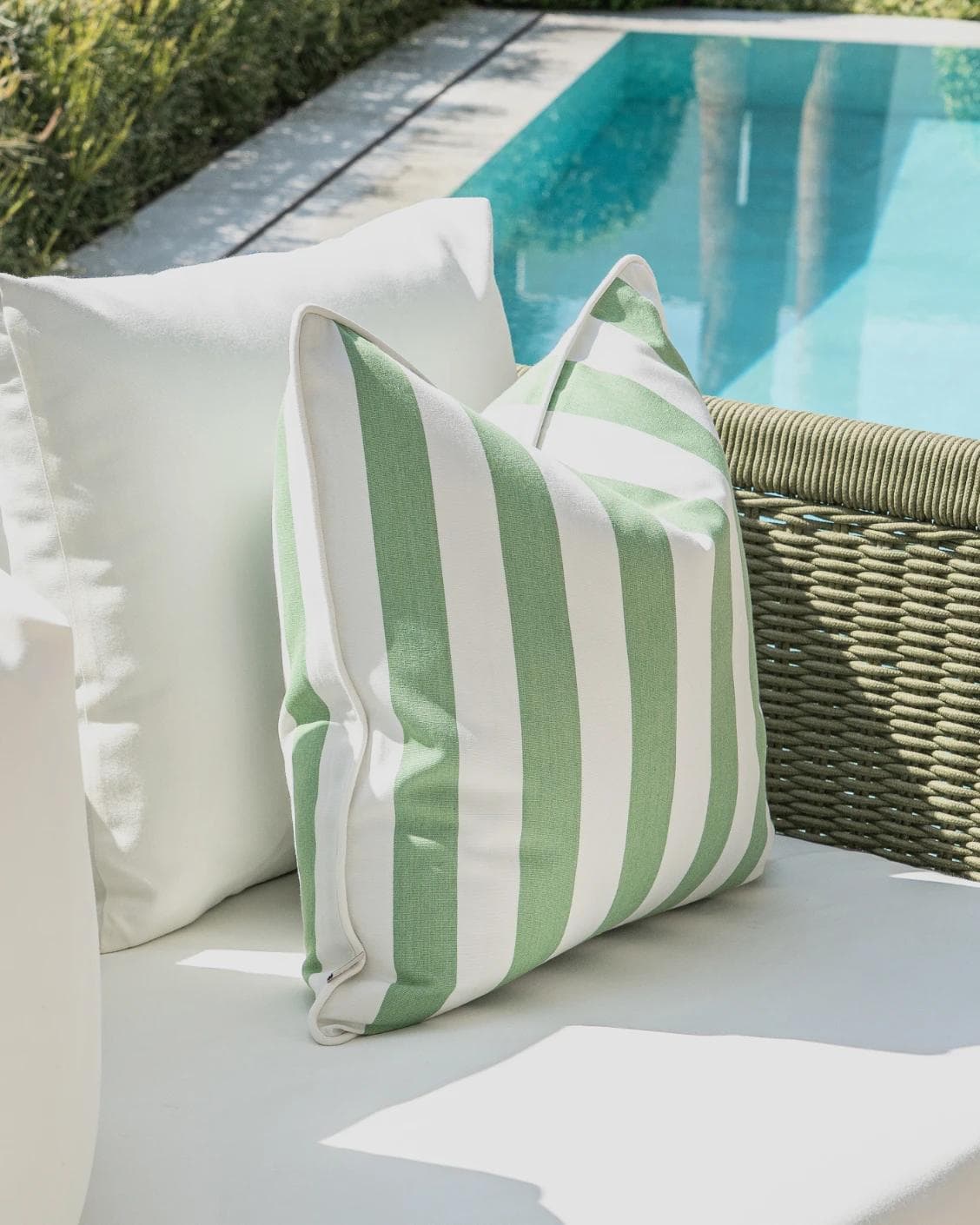 Nehal Bundle cushion in green, shown in a lifestyle left view as image 7
