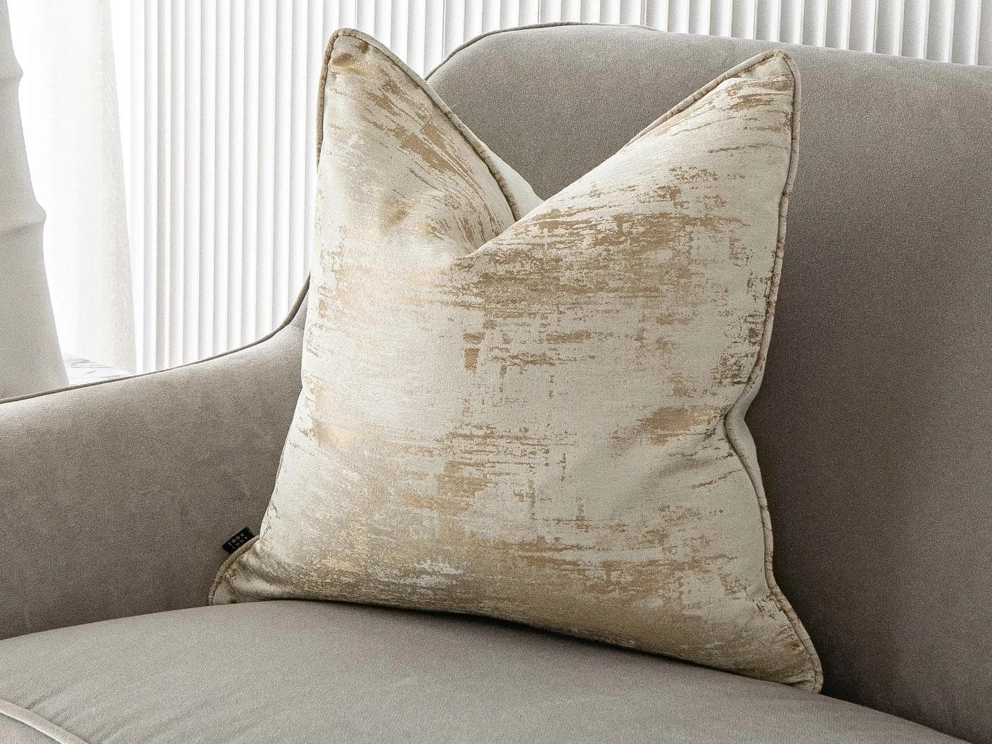 Neri Klimt cushion in gold and beige, shown in a lifestyle as image 2