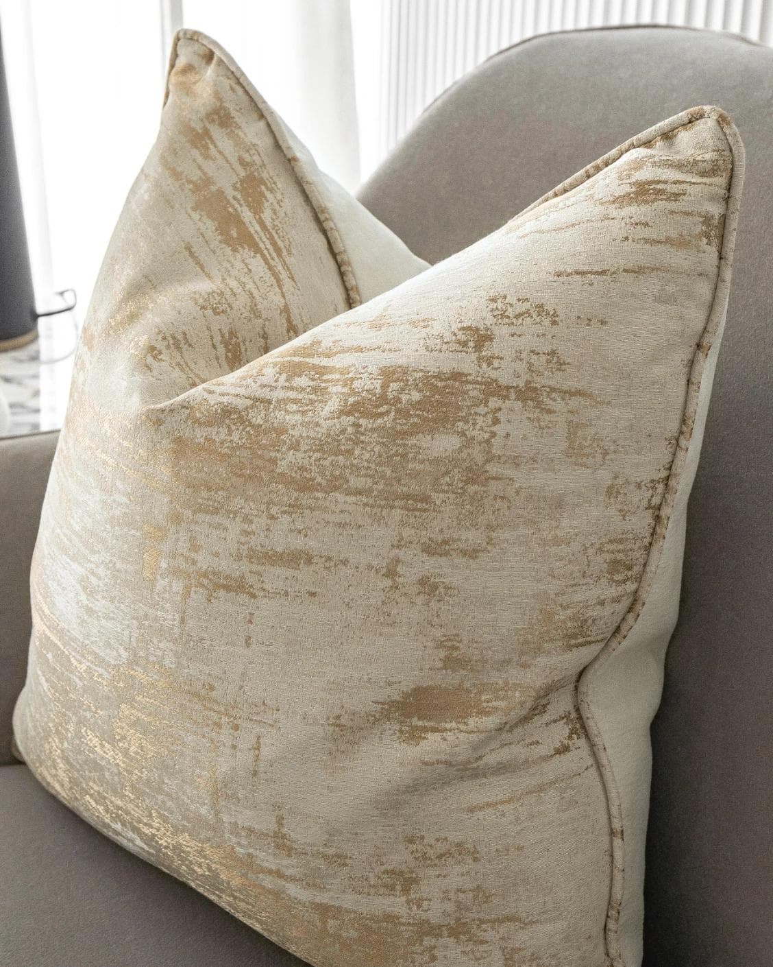 Neri Klimt cushion in gold and beige, shown in a lifestyle top view as image 5