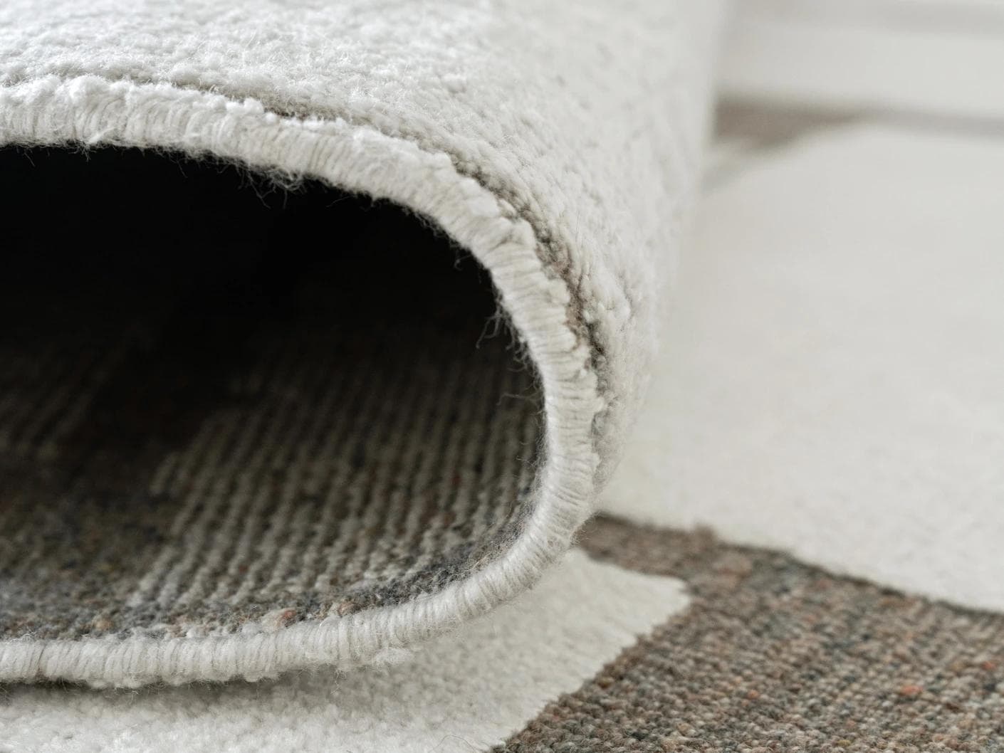 Nico Sandy carpet in ivory, grey and brown, shown in a product close-up as image 12