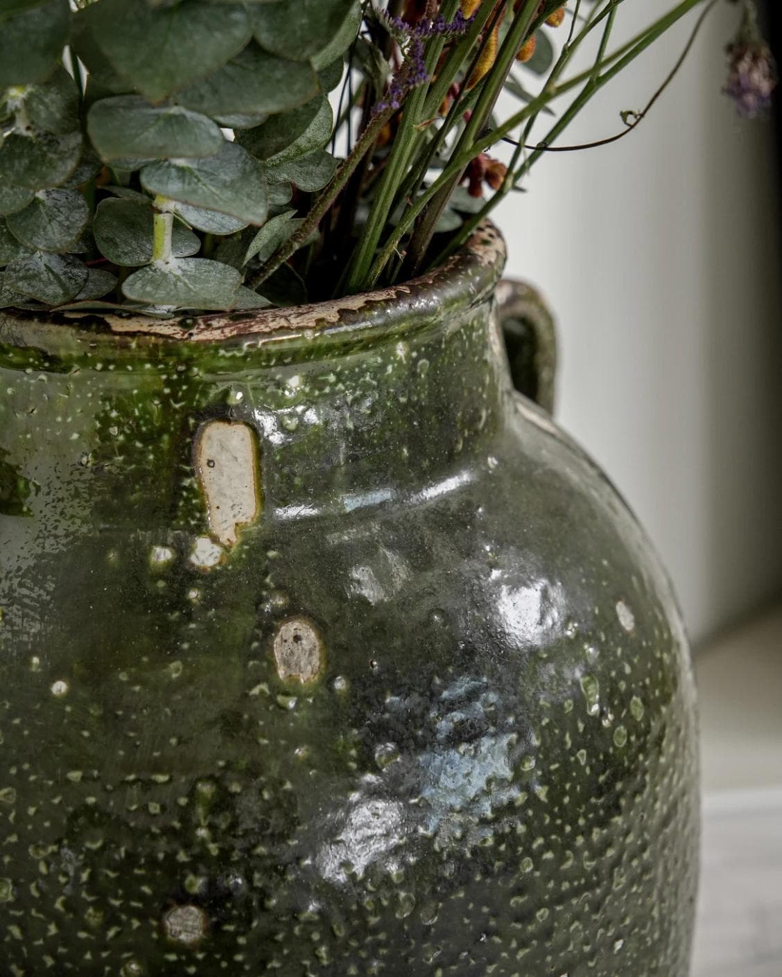 Nilsa Terra vases in deep olive and green, shown in a lifestyle close-up as image 4