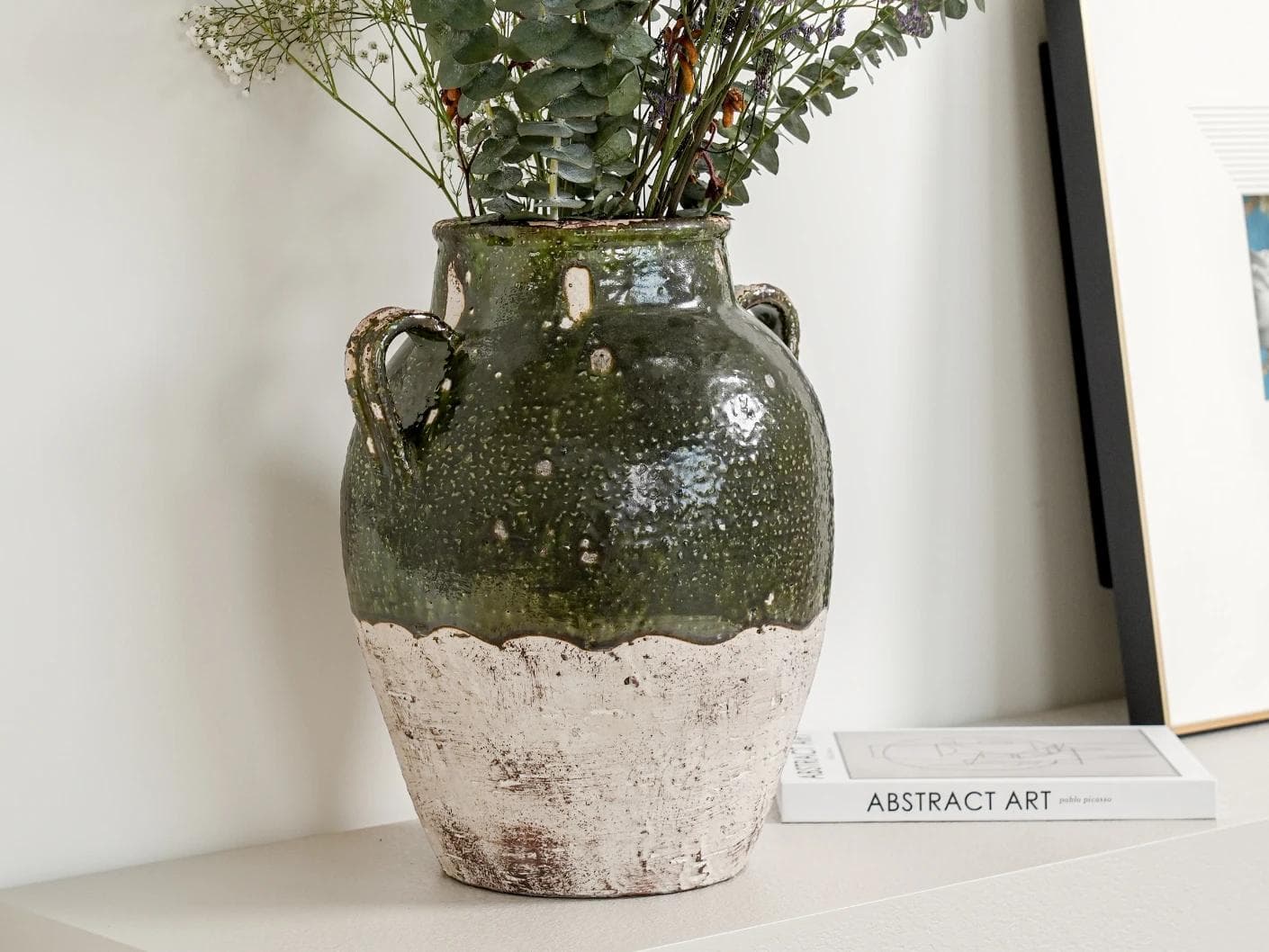 Nilsa Terra vases in deep olive and green, shown in a lifestyle left view as image 2