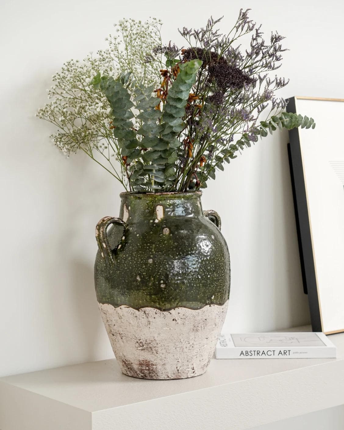 Nilsa Terra vases in deep olive and green, shown in a lifestyle left view as image 2