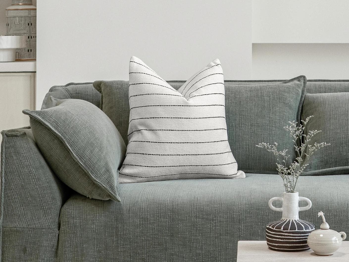Noa Bianca cushion in black and ivory, shown in a lifestyle front view as image 4