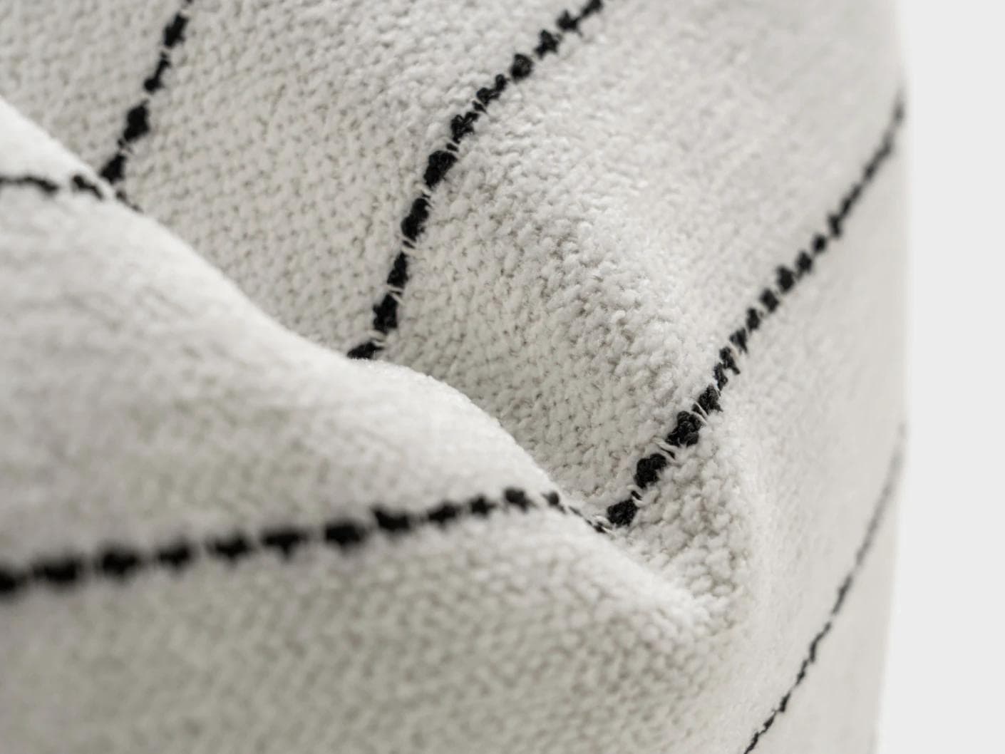 Noa Bianca cushion in black and ivory, shown in a product close-up as image 7