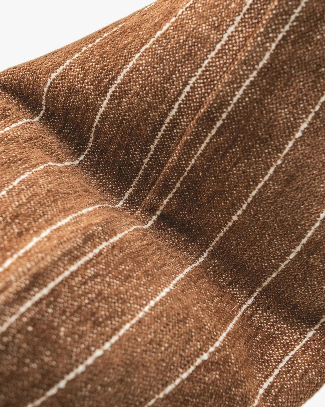 Noa Rust cushion in white and brown, shown in a product top view as image 11