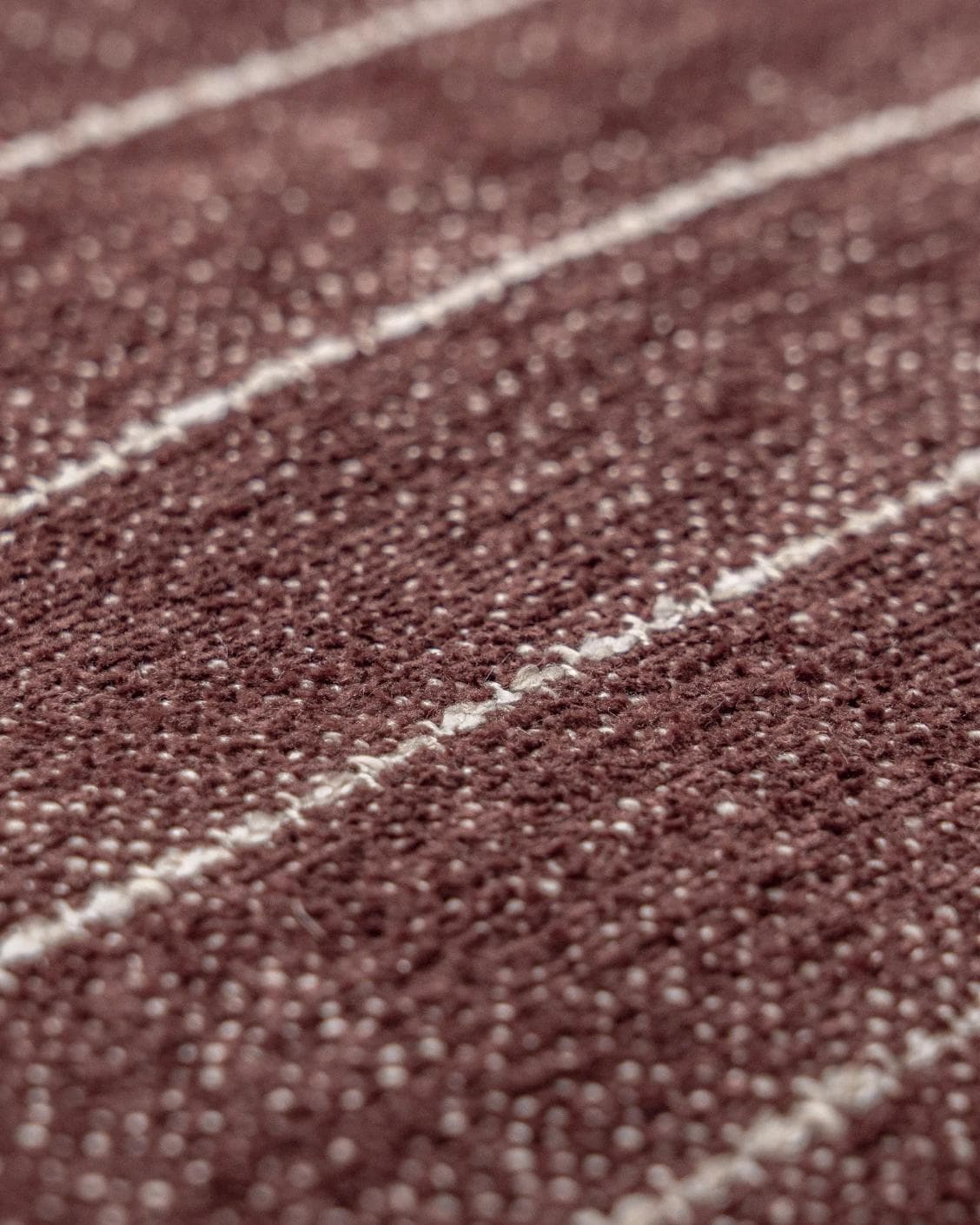 Noa Scarlet cushion in white and red, shown in a product close-up as image 6